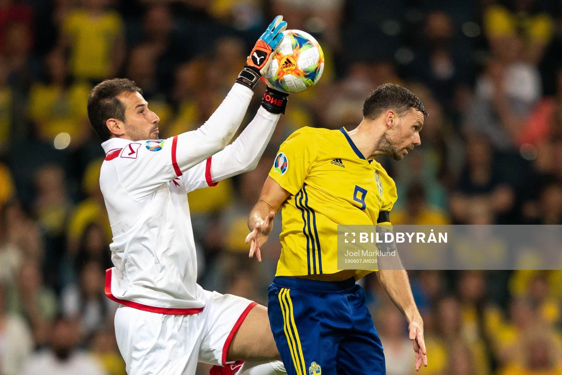 Goalkeeper Henry Bonello of Malta and Marcus Berg of Sweden