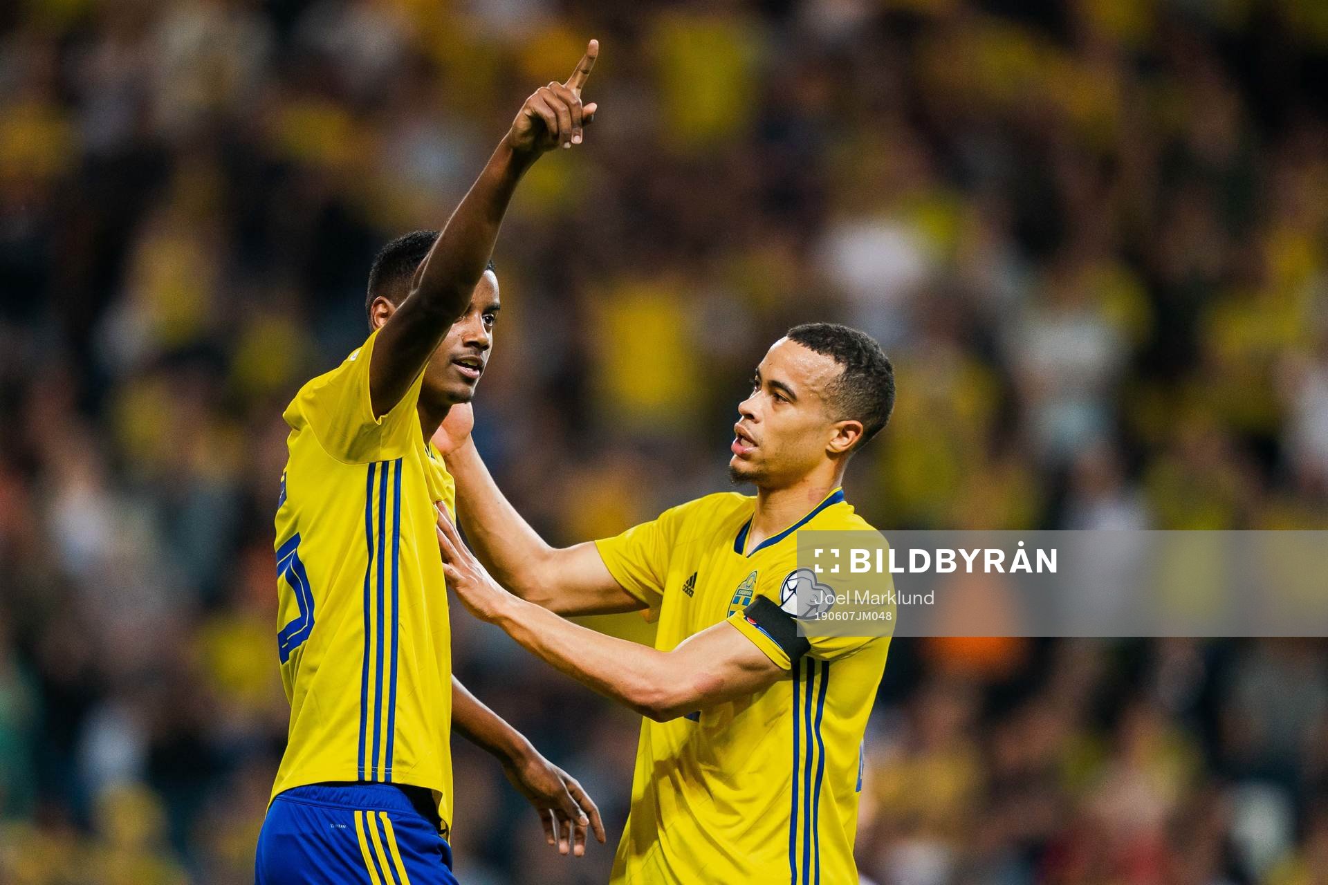 Alexander Isak and Robin Quaison of Sweden celebrate