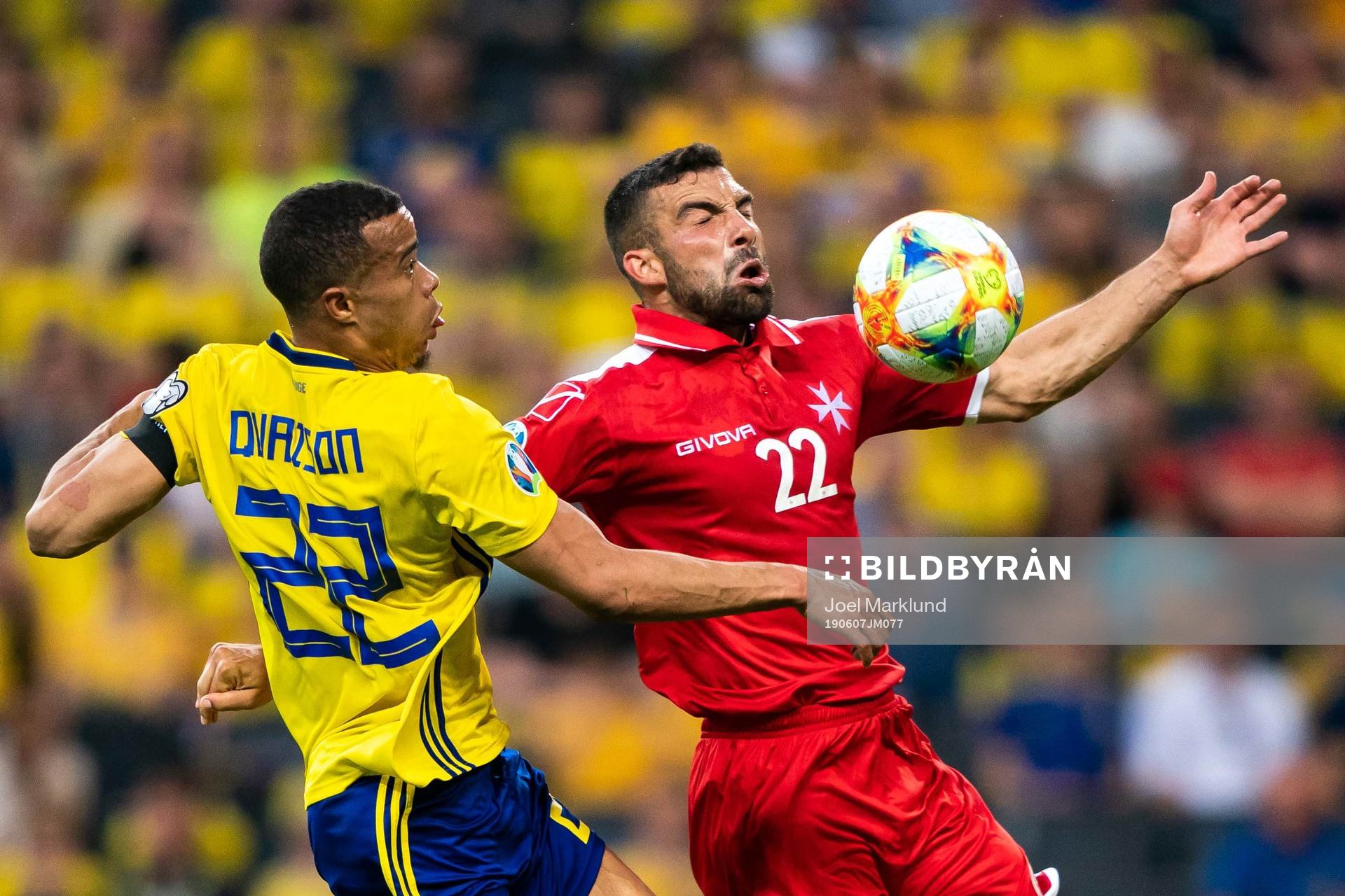 Robin Quaison of Sweden and Alfred Effiong of Malta