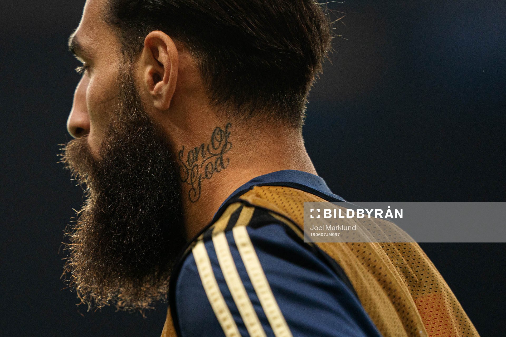 Jimmy Durmaz of Sweden with a tattoo saying Son of God