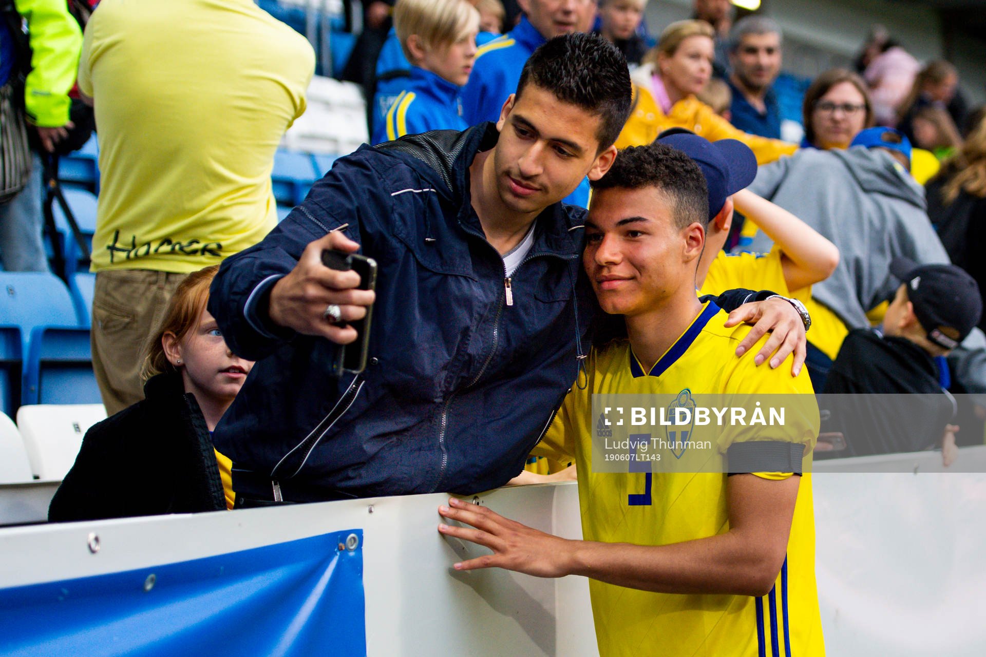 Alexander Jallow takes a picture with a member of the