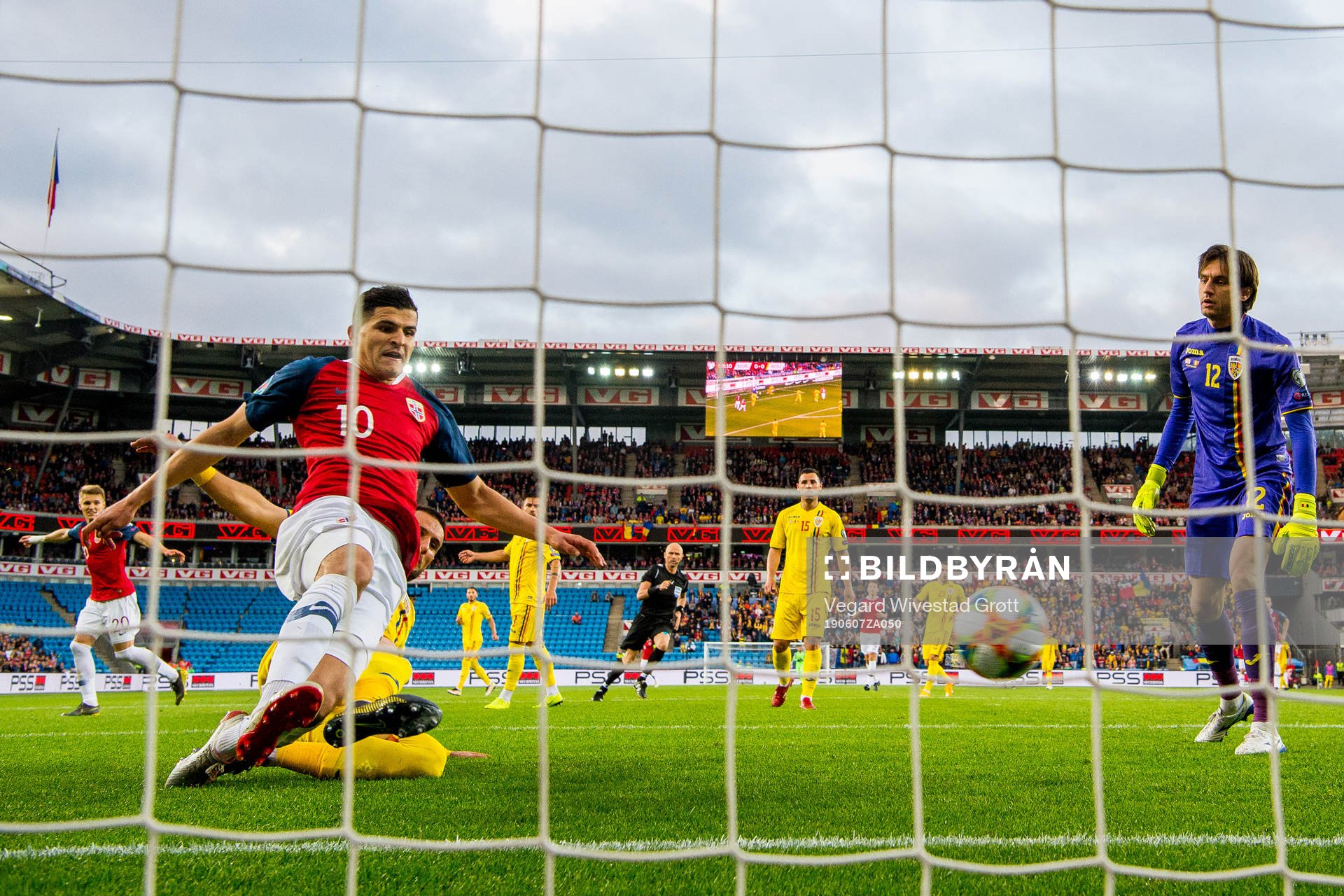 Tarik Elyounoussi of Norway scores 1-0 behind goalkeeper