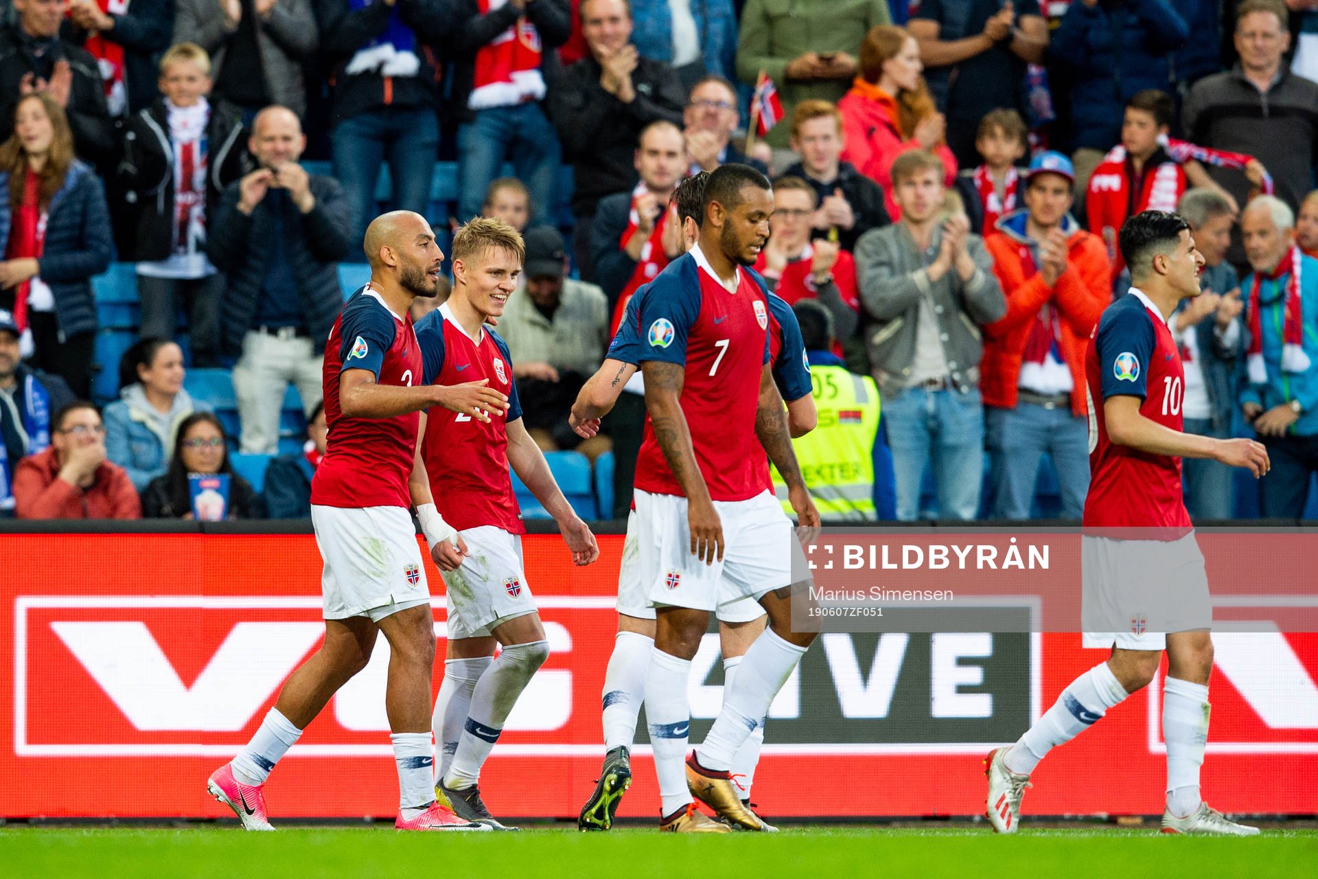 Martin Ødegaard of Norway celebrates with his teammates