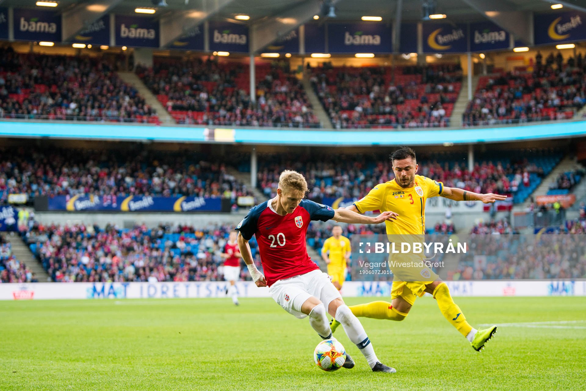 Martin Ødegaard of Norway and Alin Tosca of Romania