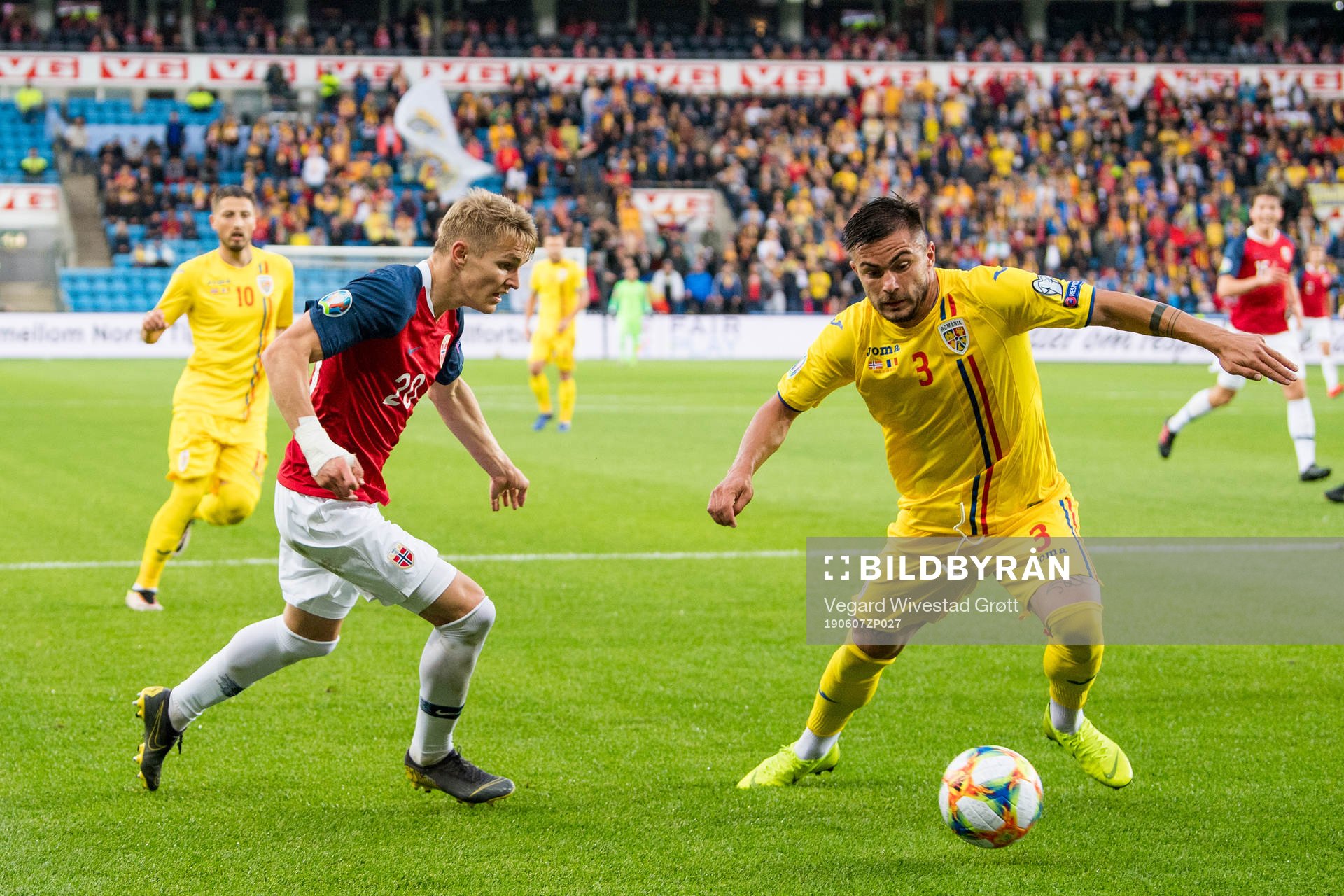 Martin Ødegaard of Norway and Alin Tosca of Romania