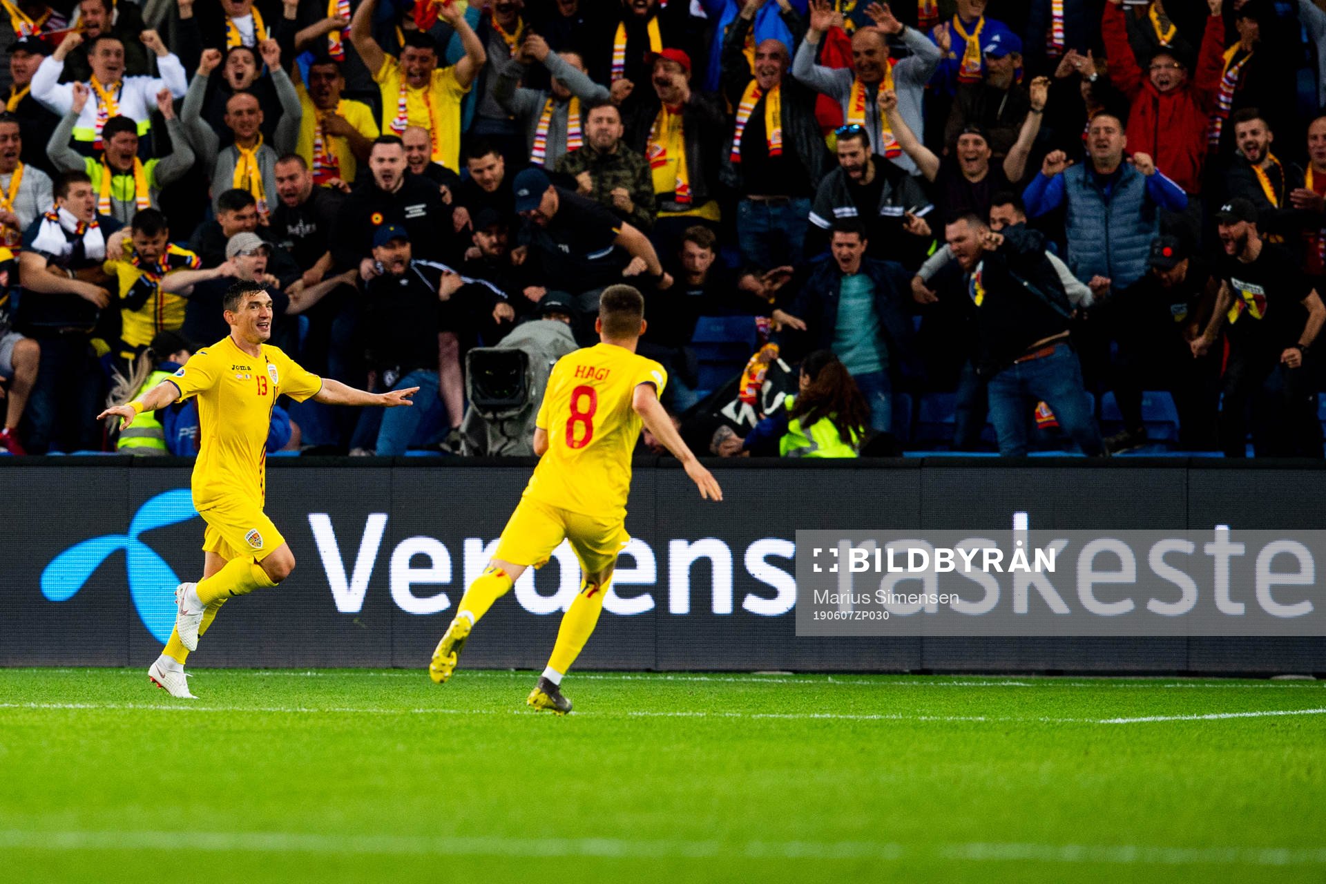 Claudiu Keseru of Romania celebrates with teammates