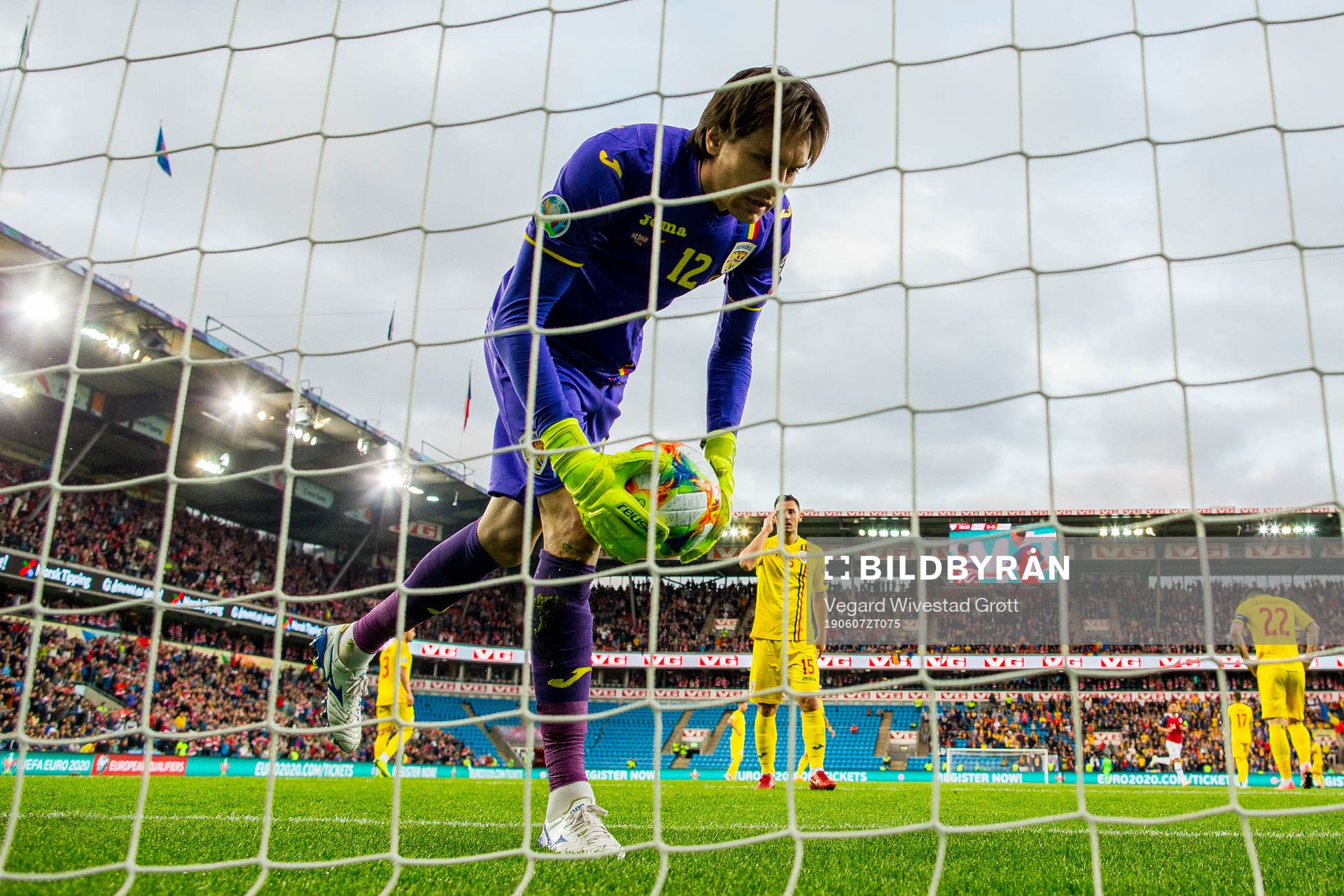 Goalkeeper Ciprian Tatarusanu of Romania looks dejected