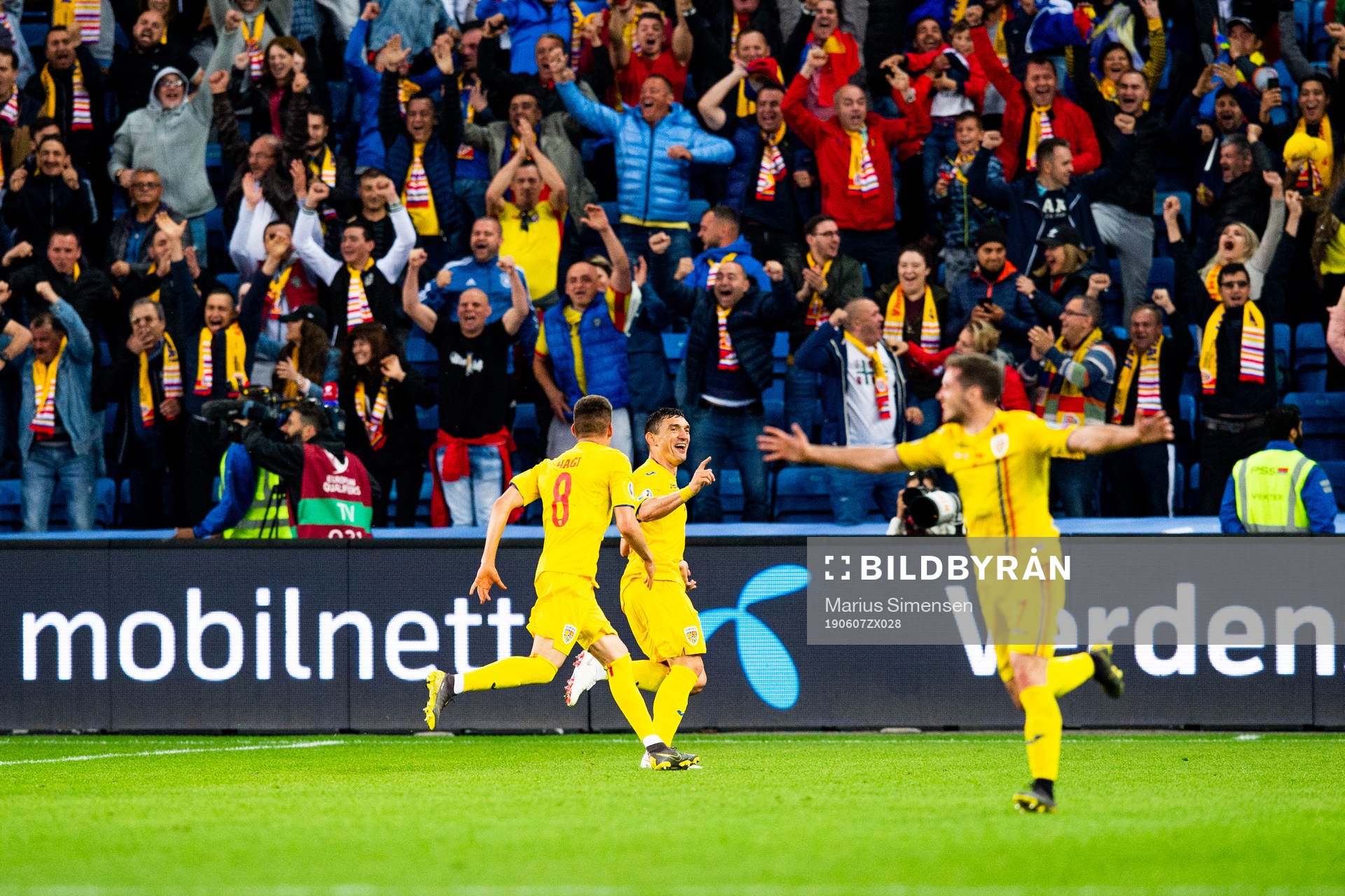 Claudiu Keseru of Romania celebrates with teammates