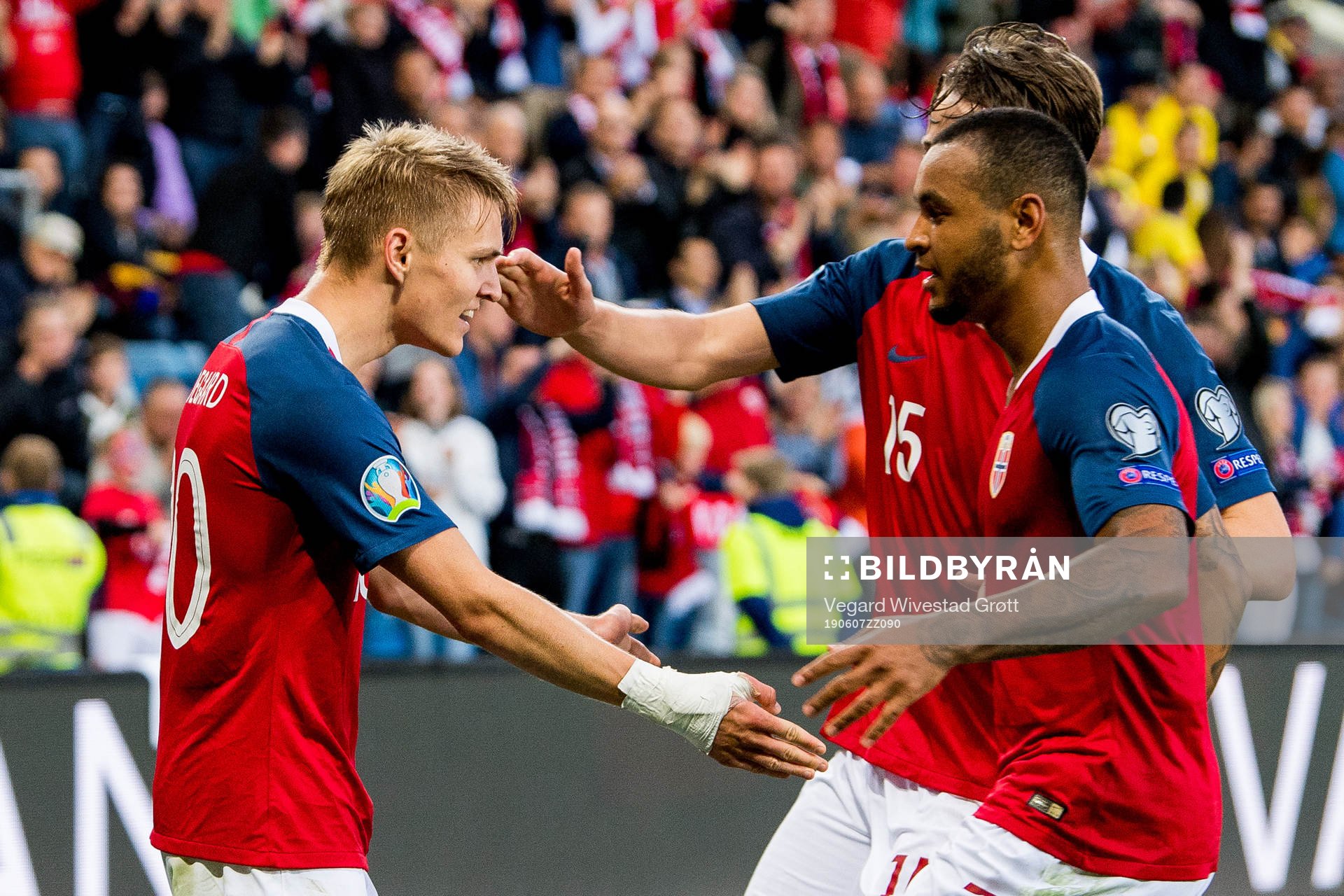 Martin Ødegaard of Norway celebrates with teammate Joshua