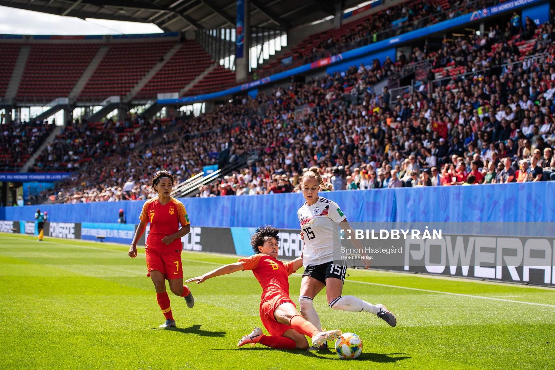 Shuang Wang and Peng Han of China against Giulia Gwinn of Germany during the FIFA Women's World Cup match between Germany and China on June 8, 2019 in Rennes.