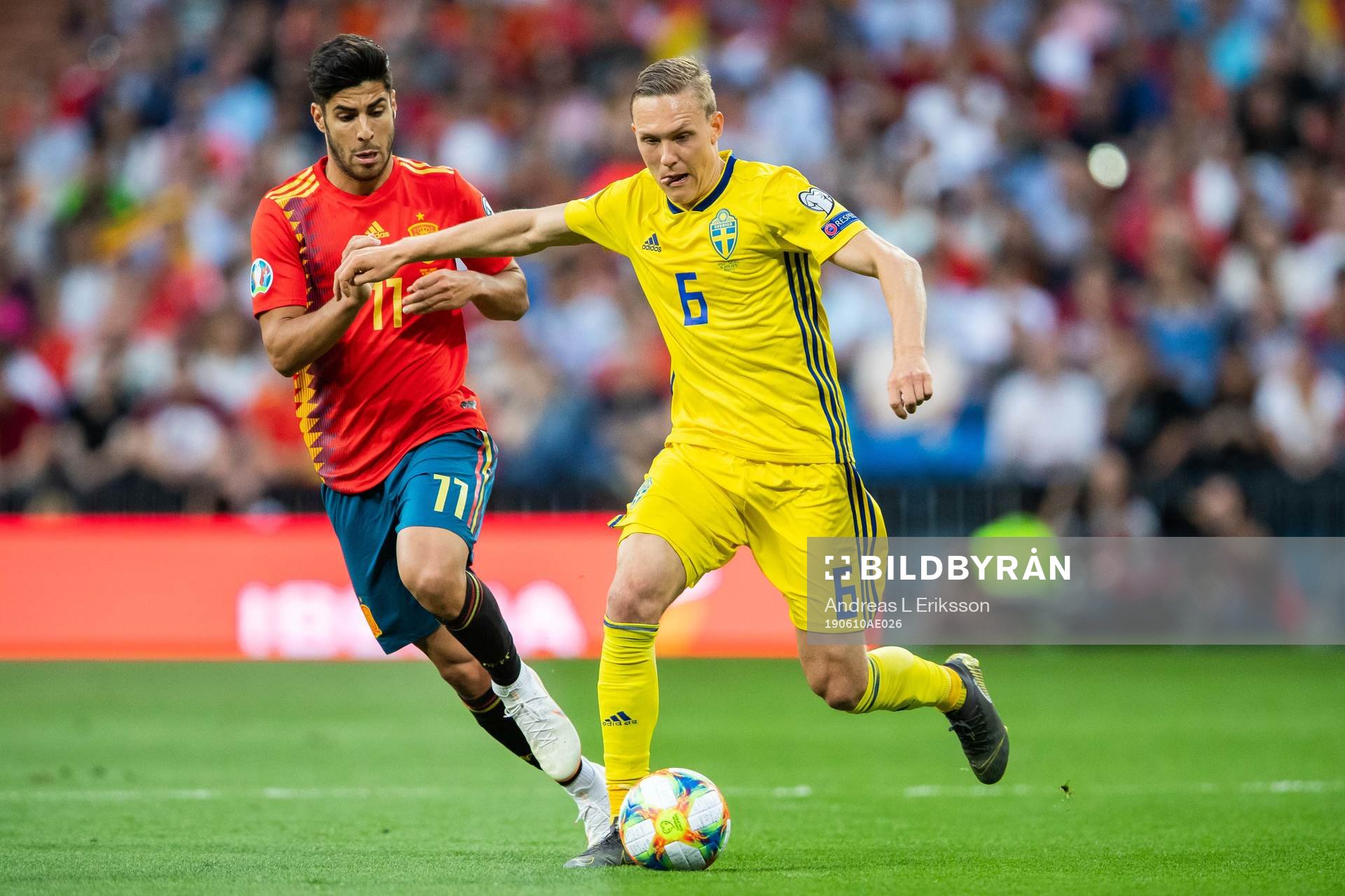 Marco Asensio of Spain and Ludwig Augustinsson of Sweden