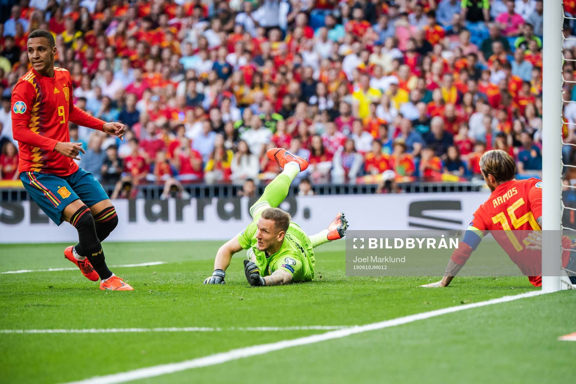 Rodrigo and Sergio Ramos of Spain against goalkeeper Robin Olsen of Sweden during the UEFA Euro Qualifier football match between Spain and Sweden on June 10, 2019 in Madrid.