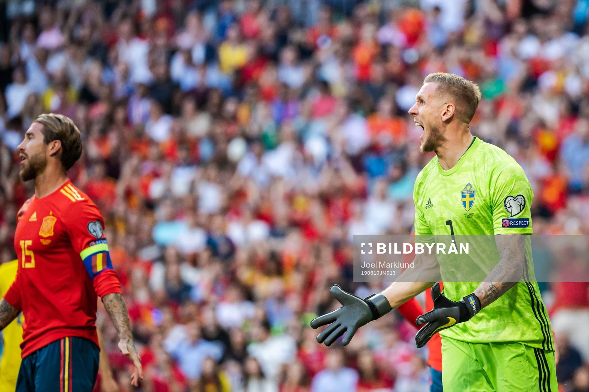 Sergio Ramos of Spain and goalkeeper Robin Olsen of Sweden during the UEFA Euro Qualifier football match between Spain and Sweden on June 10, 2019 in Madrid.