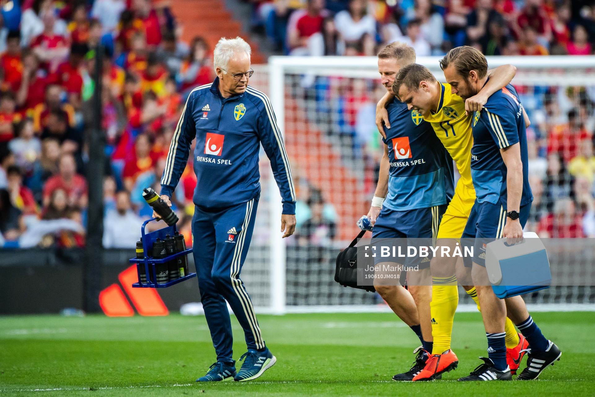 Viktor Claesson of Sweden receives help of the pitch