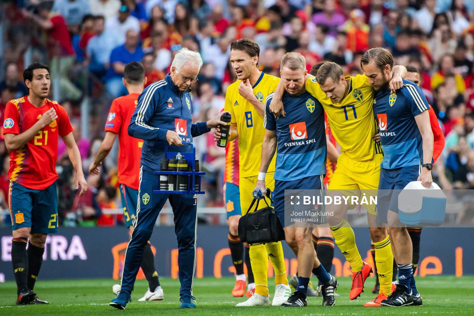 Viktor Claesson of Sweden receives help of the pitch