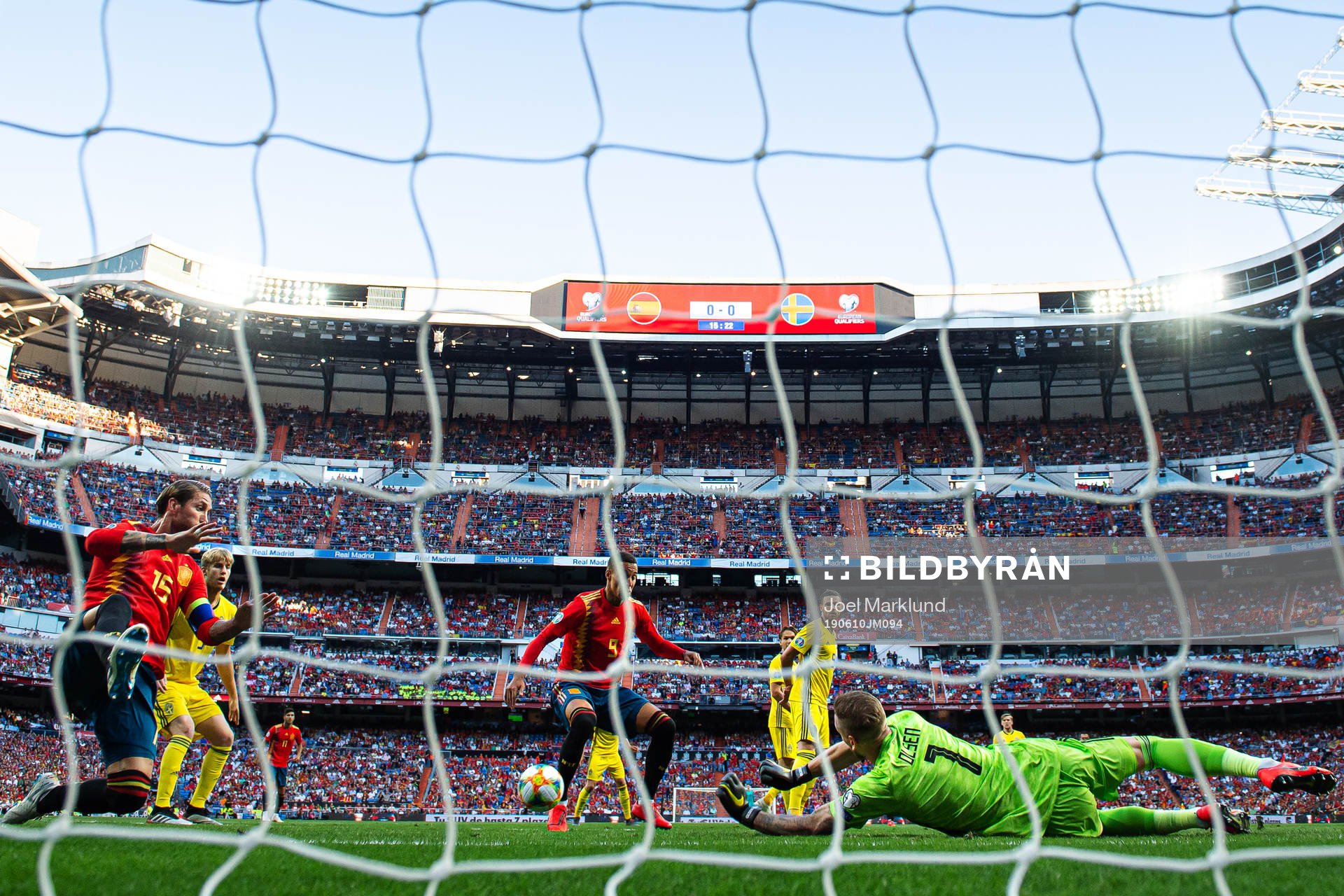 Sergio Ramos and Rodrigo of Spain in action against goalkeeper Robin Olsen of Sweden during the UEFA Euro Qualifier football match between Spain and Sweden on June 10, 2019 in Madrid.
