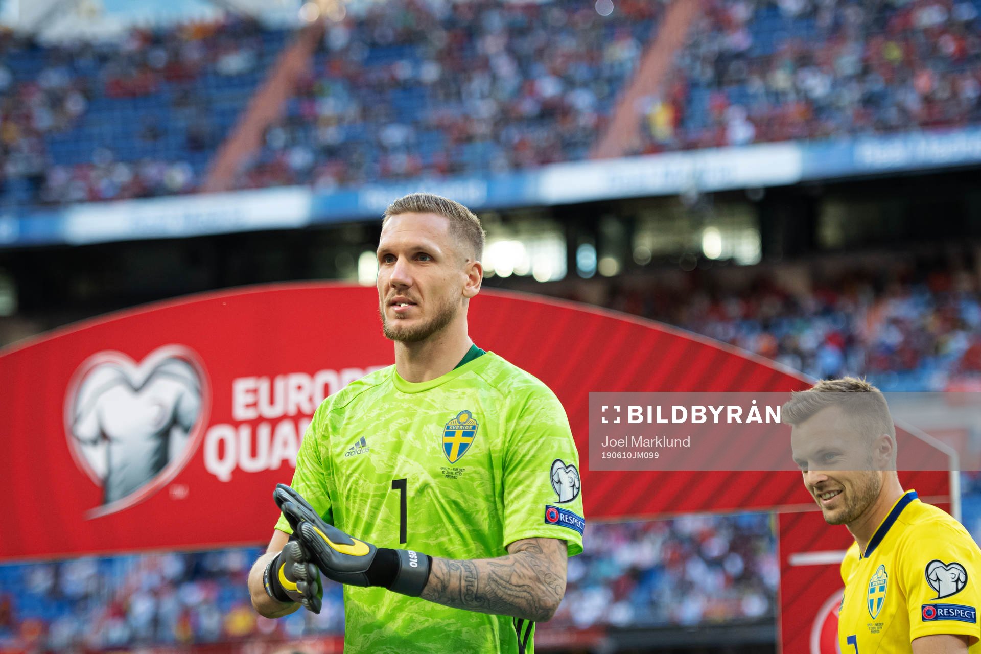 Goalkeeper Robin Olsen and Sebastian Larsson of Sweden