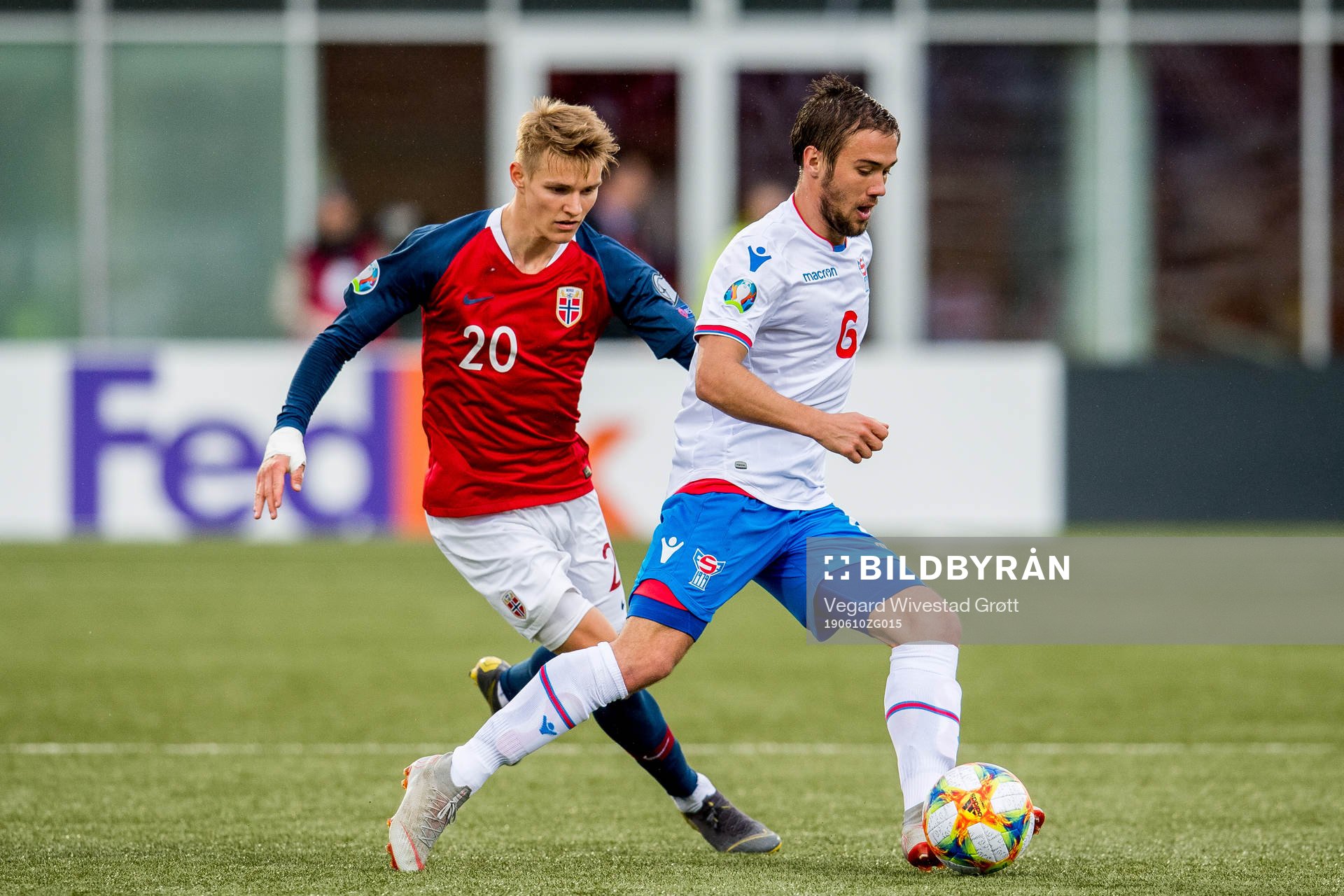Martin Ødegaard of Norway and Hallur Hansson of Faroe