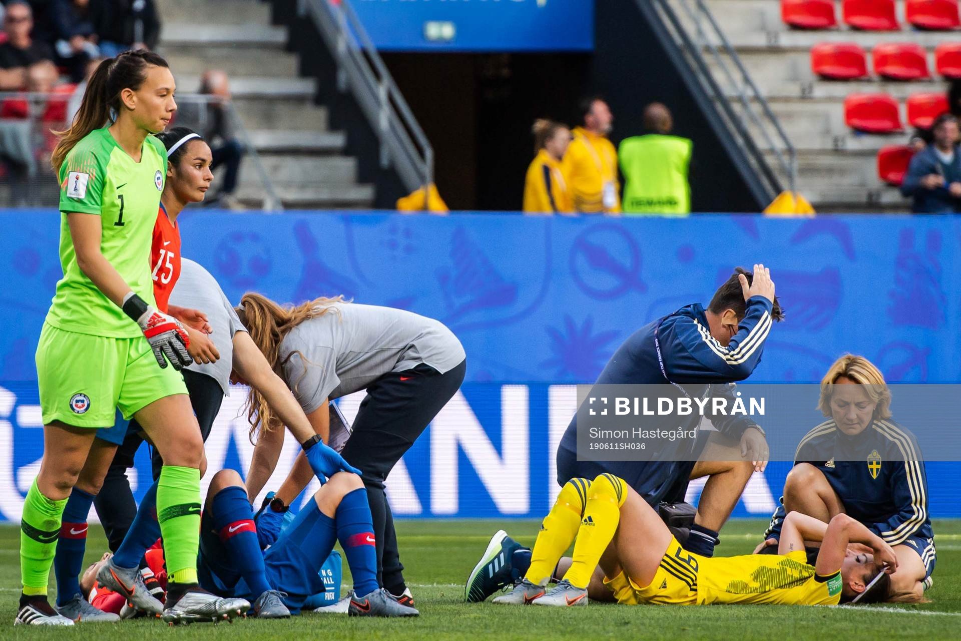 Kosovare Asllani of Sweden receives help