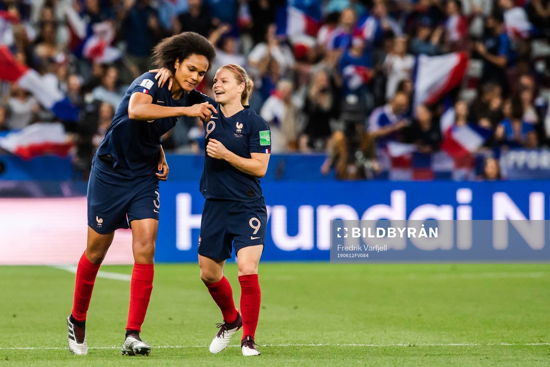 Wendie Renard and Eugénie Le Sommer of France  celebrate