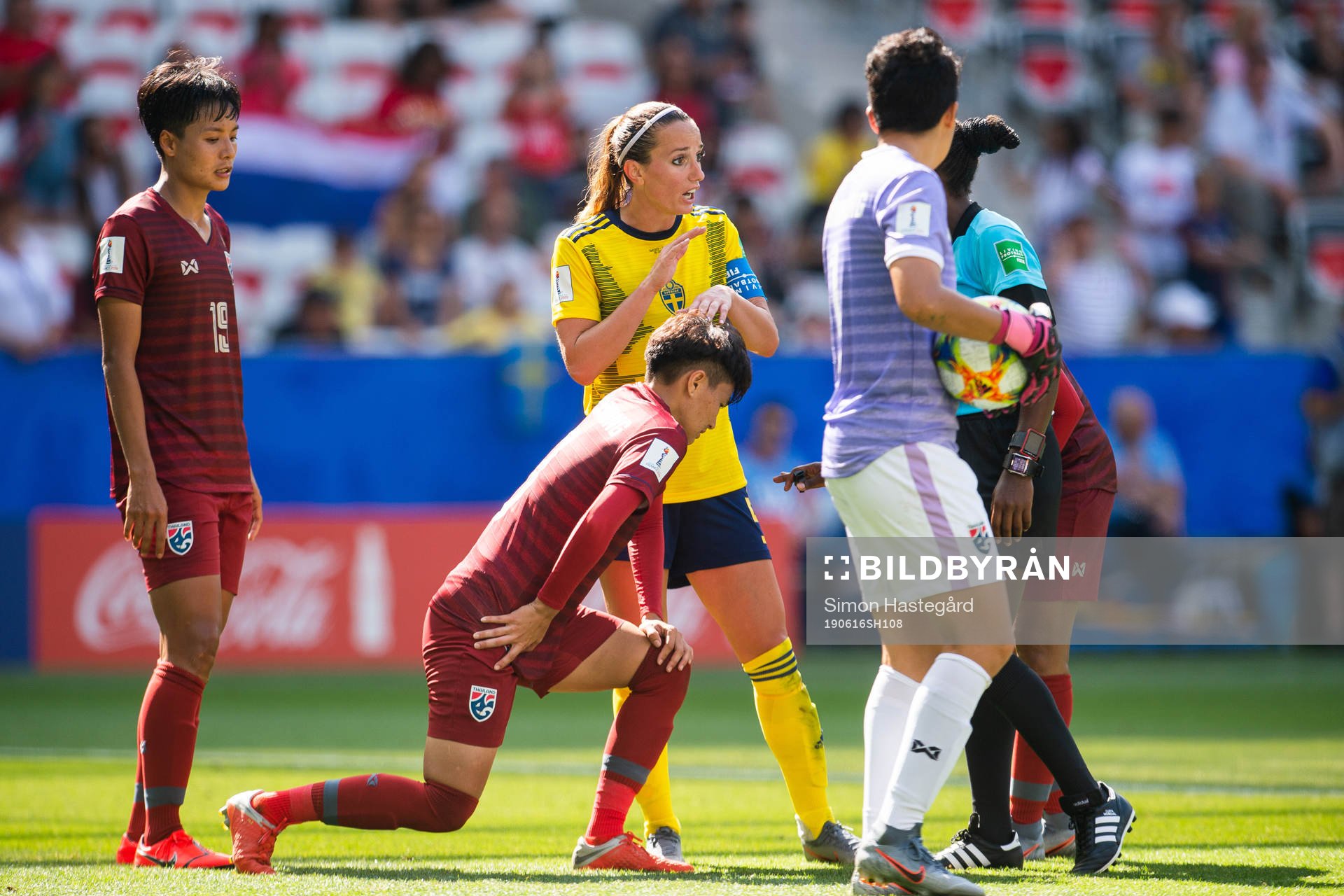 Kosovare Asllani of Sweden talks to the referee