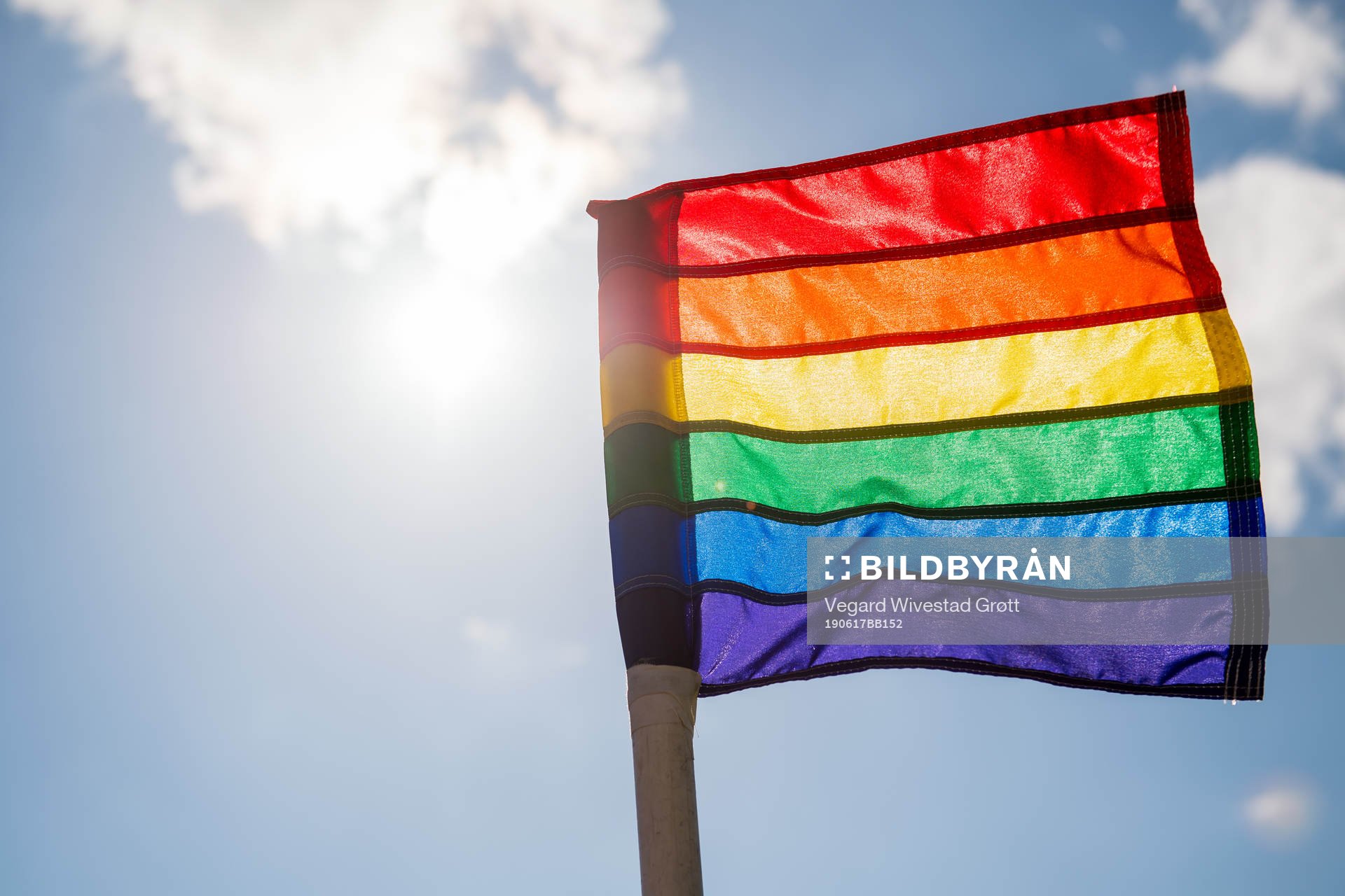 A rainbow-colored corner flag