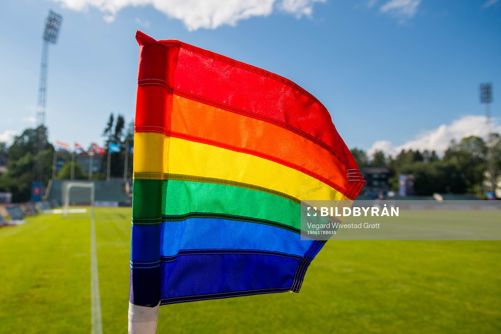 A rainbow-colored corner flag