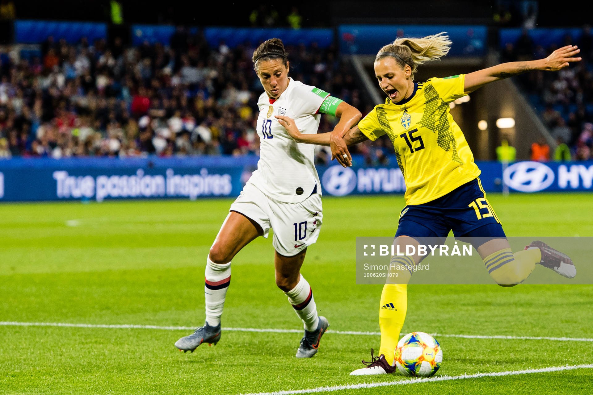 Carli Lloyd  of USA and Nathalie Björn of Sweden