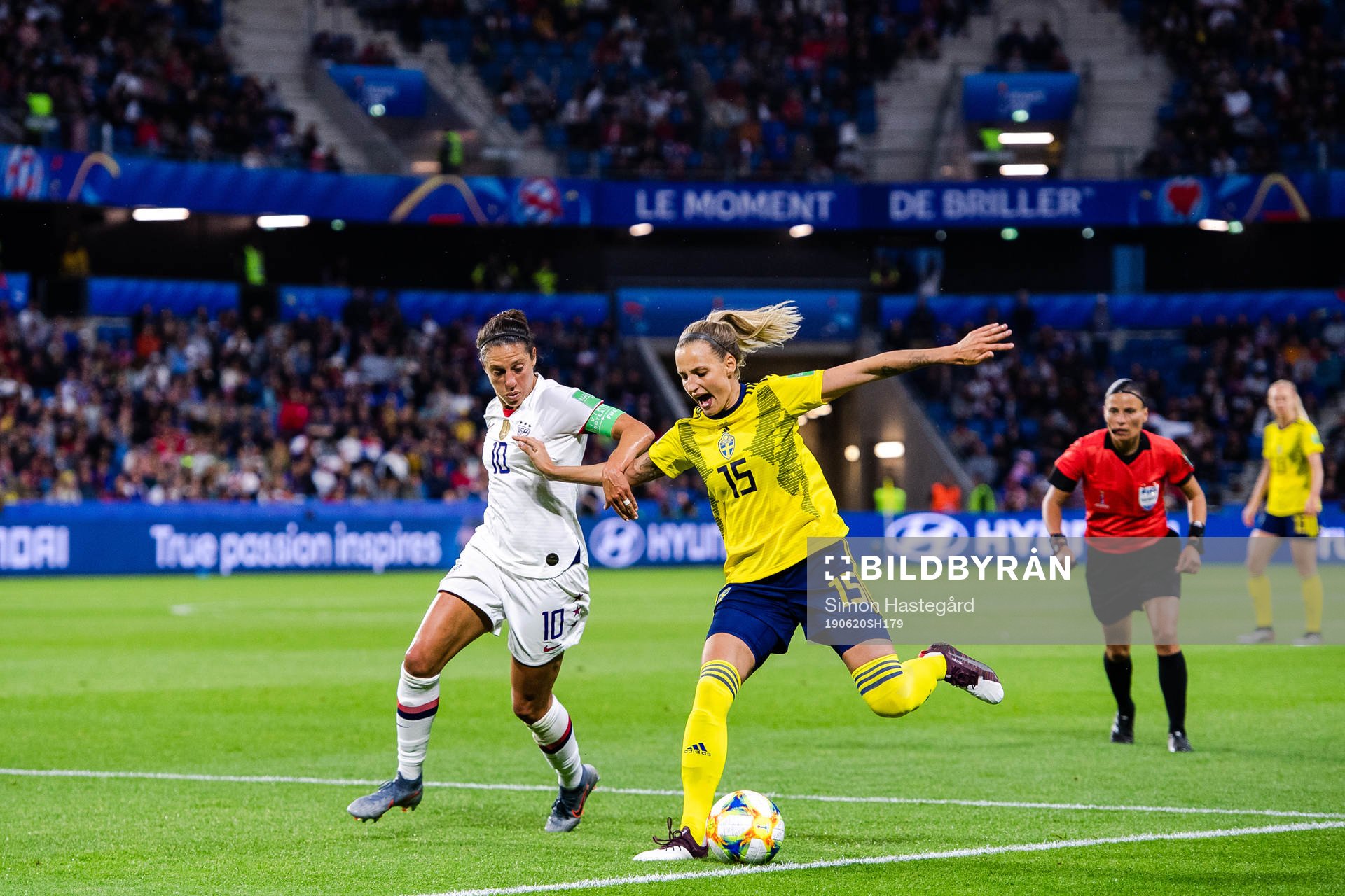 Carli Lloyd  of USA and Nathalie Björn of Sweden