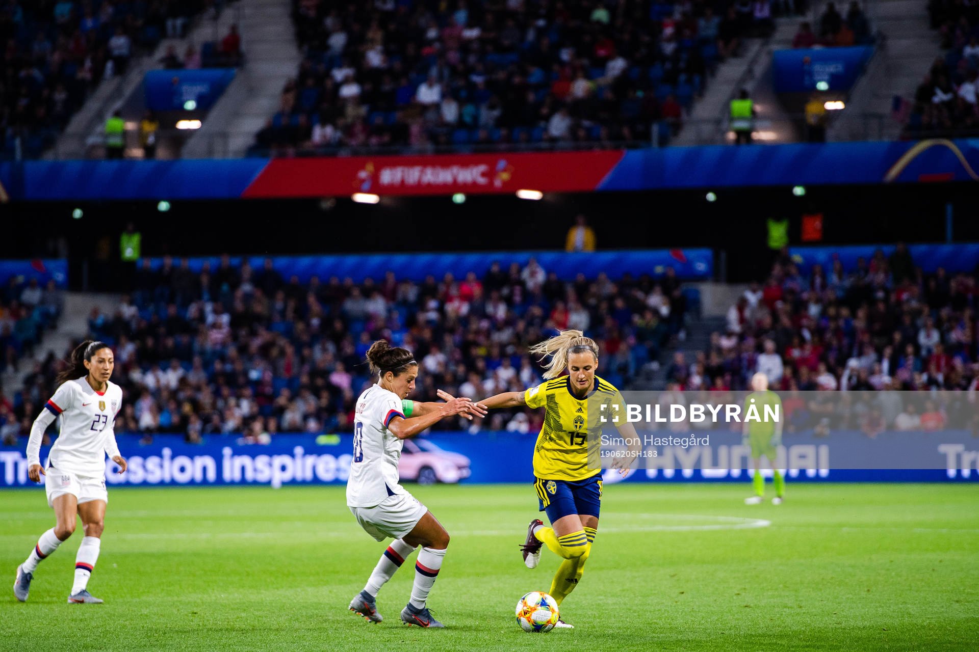 Carli Lloyd  of USA and Nathalie Björn of Sweden