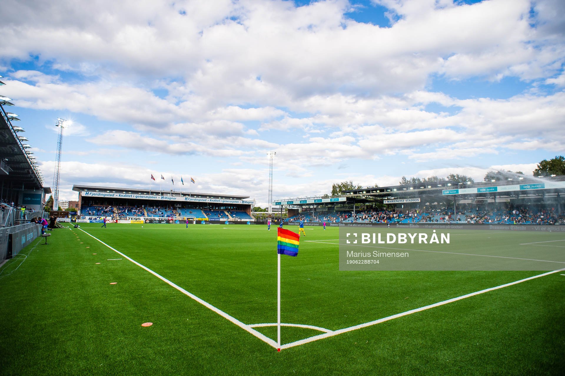 A rainbow-colored corner flag at Marienlyst Stadion