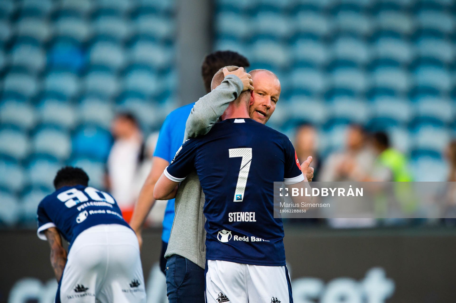 Henrik Pedersen, head coach of Strømsgodset,  hugs Herman