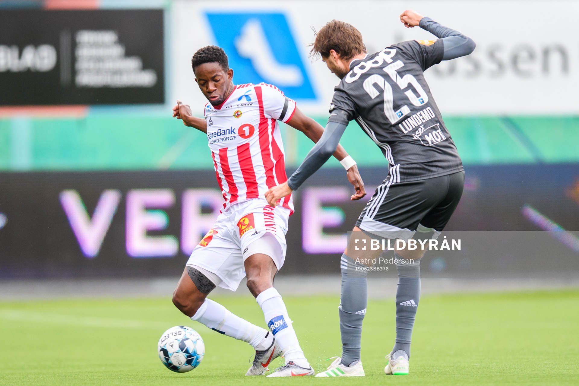 Mushaga Bakenga of Tromsø and Marius Lundemo of Rosenborg during the Eliteserien match between Tromsø and Rosenborg on June 23, 2019 in Tromsø.