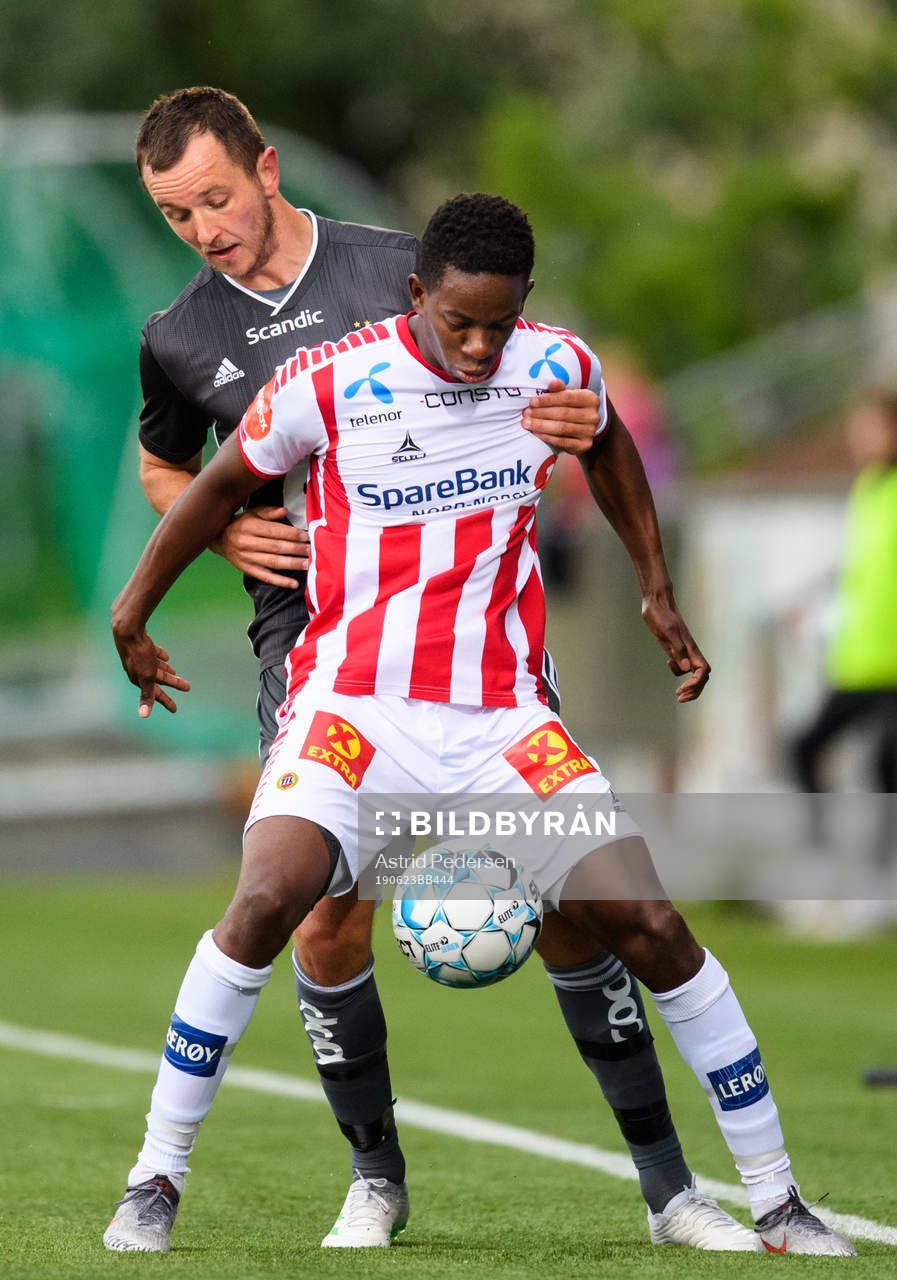 Even Hovland of Rosenborg and Mushaga Bakenga of Tromsø during the Eliteserien match between Tromsø and Rosenborg on June 23, 2019 in Tromsø.