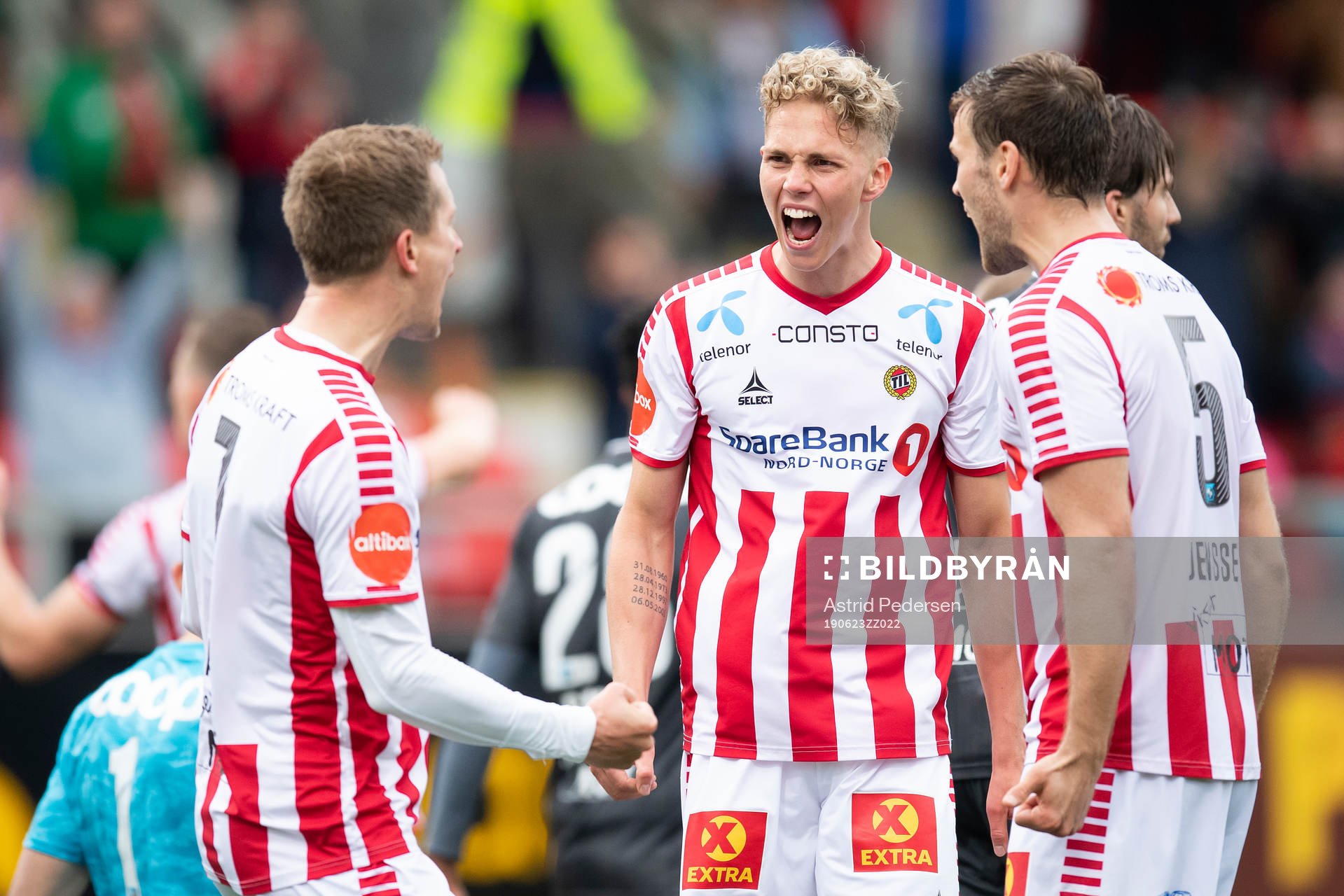 Morten Gamst Pedersen, Onni Valakari and Anders Jenssen of Tromsø celebrate after the Eliteserien match between Tromsø and Rosenborg on June 23, 2019 in Tromsø.