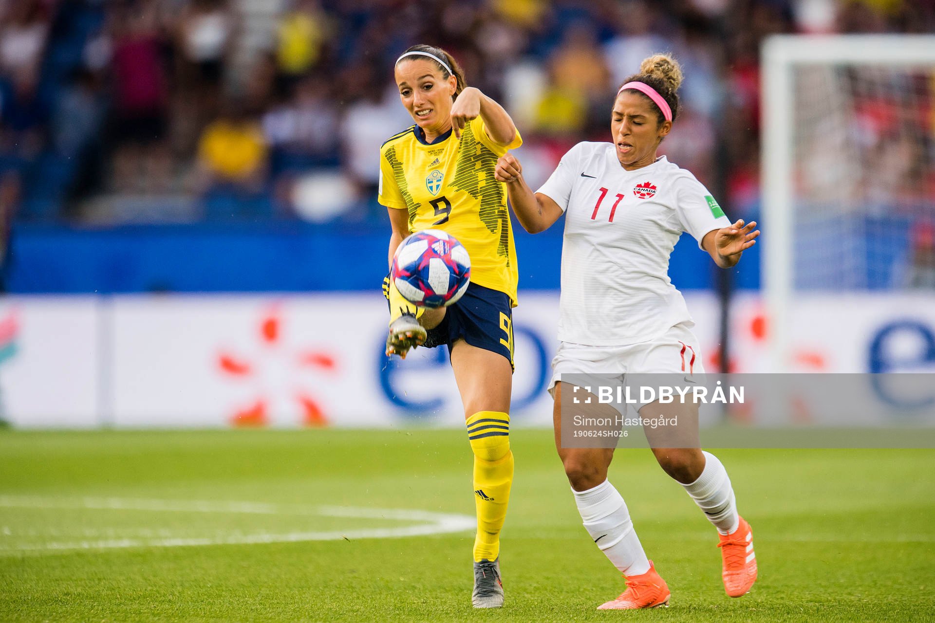Kosovare Asllani of Sweden and Desiree Scott of Canada