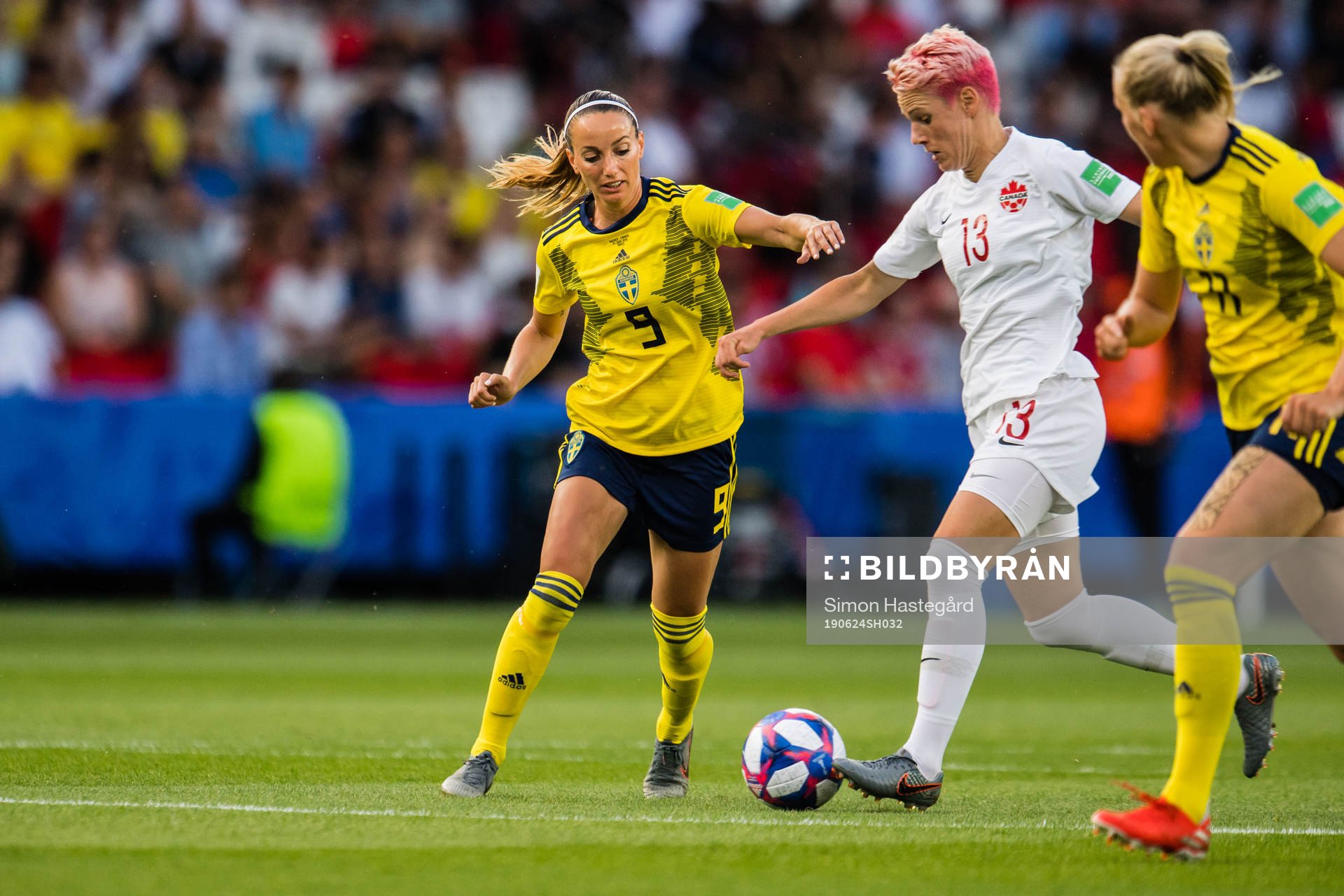 Kosovare Asllani of Sweden and Sophie Schmidt of Canada