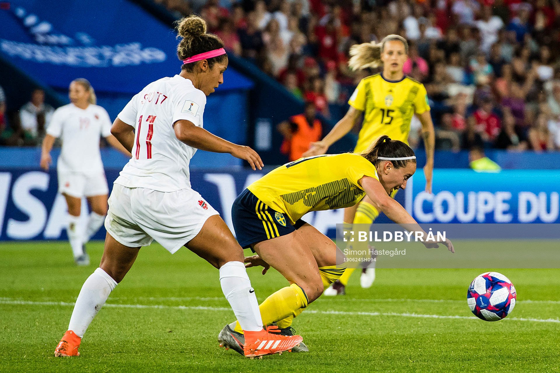Desiree Scott of Canada and Kosovare Asllani of Sweden