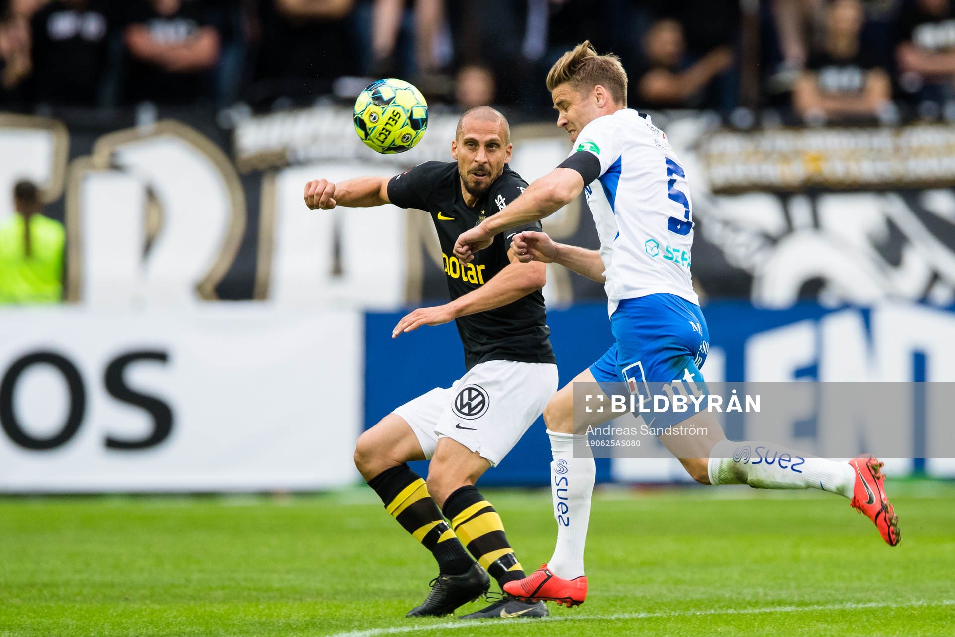 AIK:s Panajotis Dimitriadis i kamp om bollen med IFK Norrköpings Christoffer Nyman under fotbollsmatchen i Allsvenskan mellan AIK och IFK Norrköping den 25 juni 2019 i Stockholm.