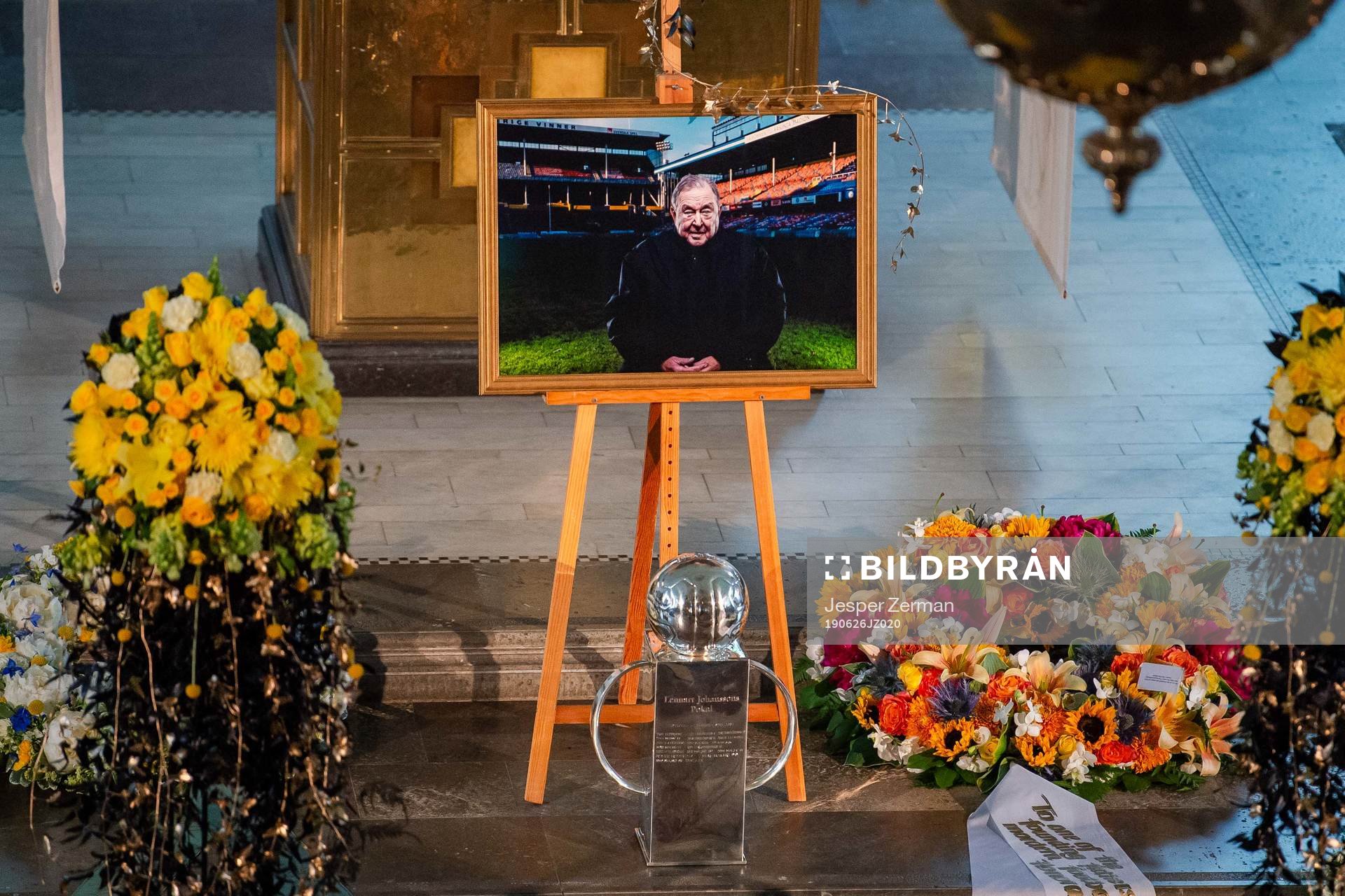 A portrait and Lennart Johansson Trophy