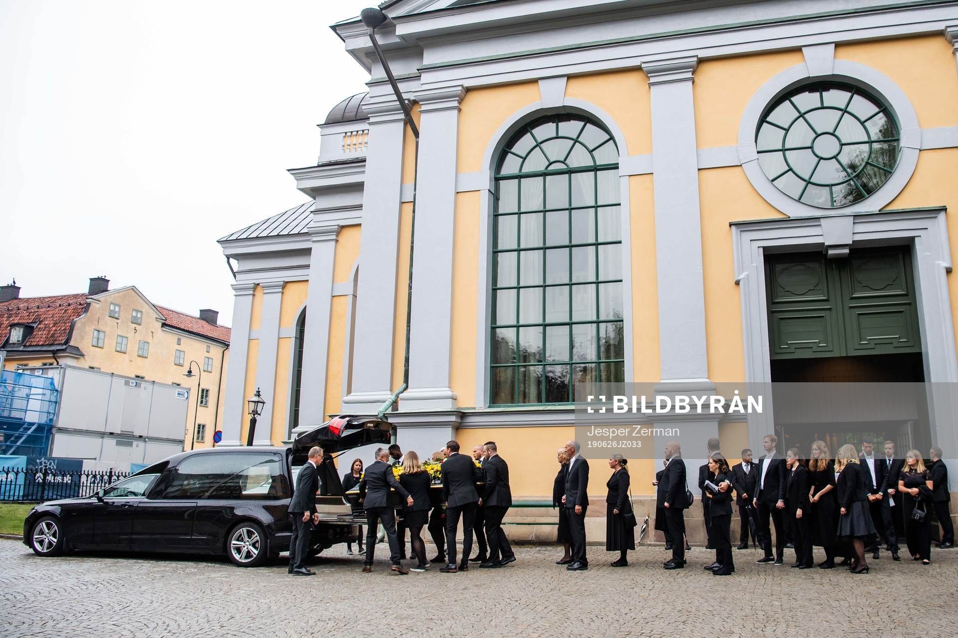 The coffin is carried out of the church