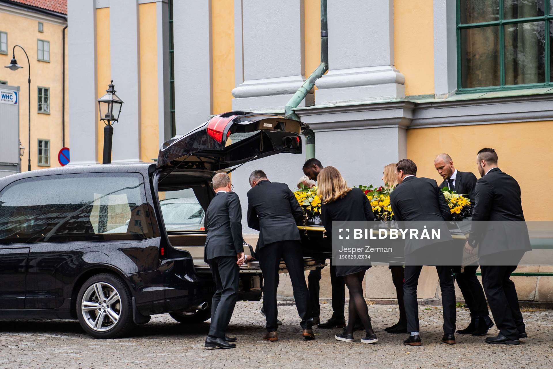The coffin is carried out of the church