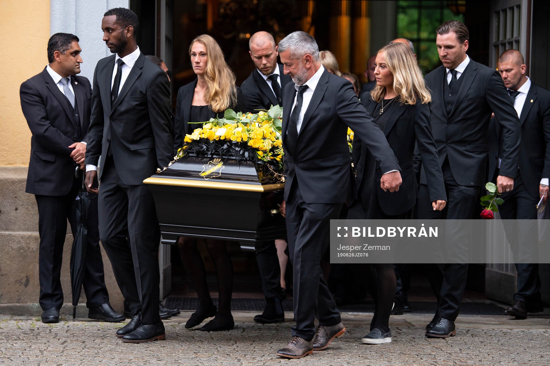 Football player Henok Goitom, Per Karlsson, Matilda Rosqvist, Elsa Törnblom and former football player Nebojsa Novakovic and Nils Eric Johansson of AIK carries out the coffin after the funeral of former UEFA president Lennart Johansson on June 26, 2019 in Stockholm.