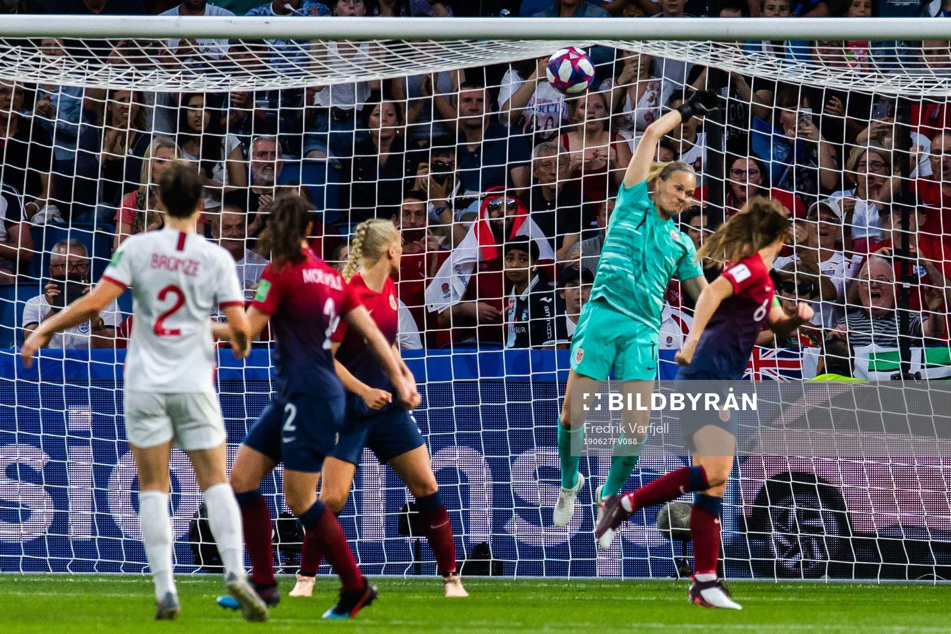 Lucy Bronze of England scores 0-3 behind goalkeeper Ingrid