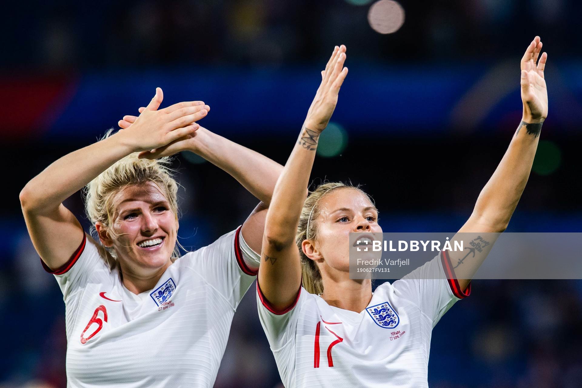 Millie Bright and Rachel Daly of England celebrate