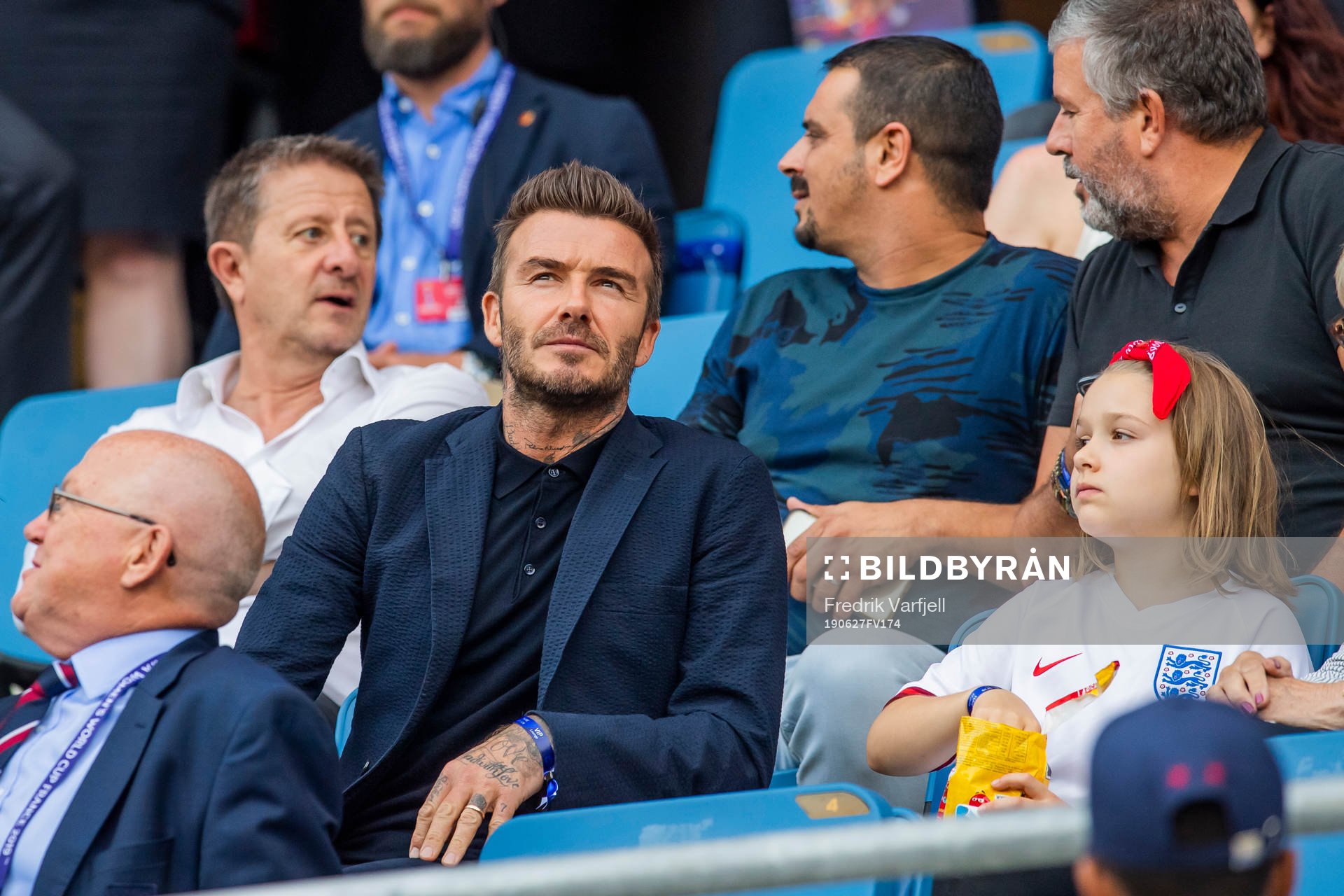 Former football player David Beckham with his daughter Harper in the stands ahead of the FIFA Women's World Cup Quarter Final match between Norway and England on June 27, 2019 in Le Havre.