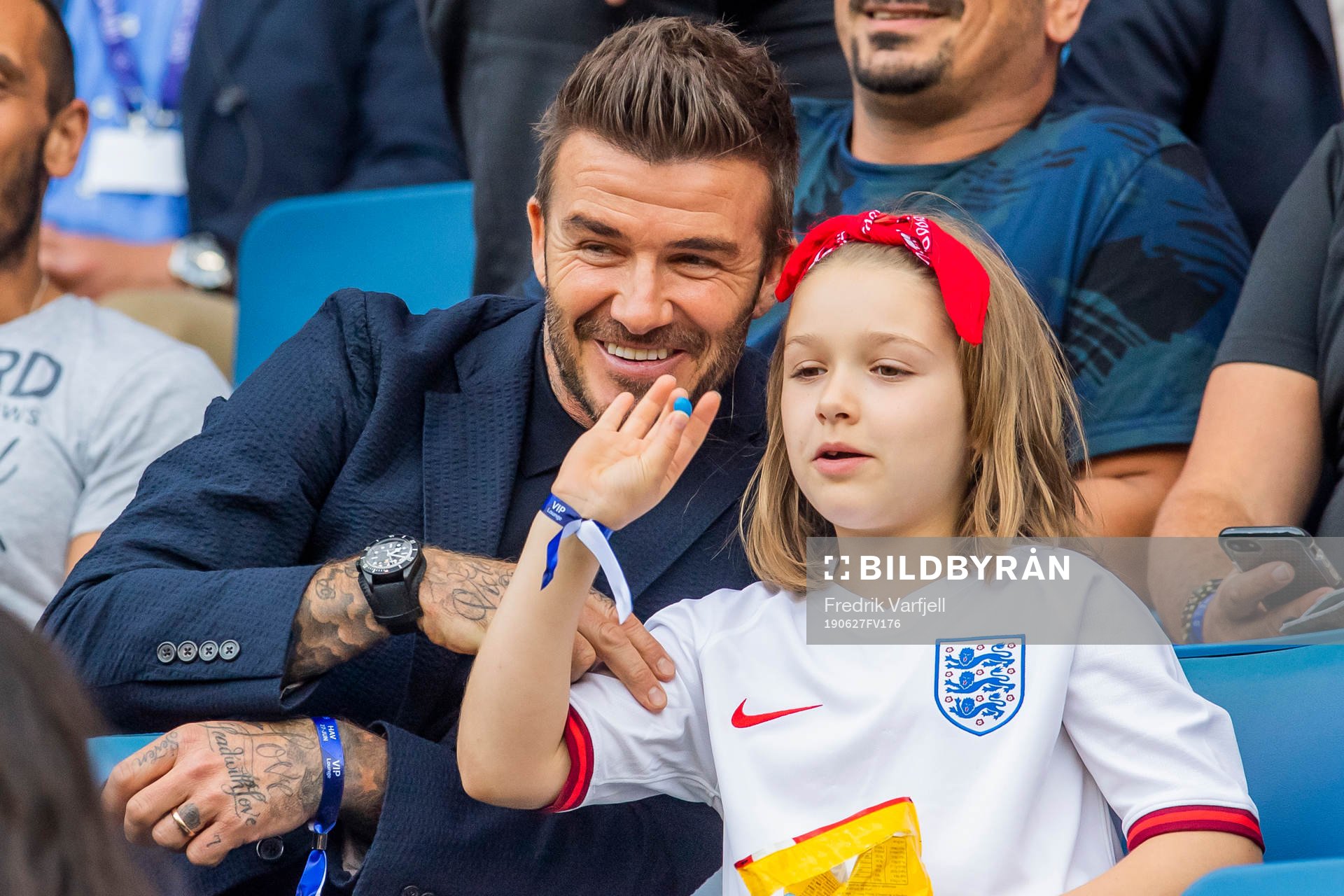 Former football player David Beckham with his daughter Harper in the stands ahead of the FIFA Women's World Cup Quarter Final match between Norway and England on June 27, 2019 in Le Havre.