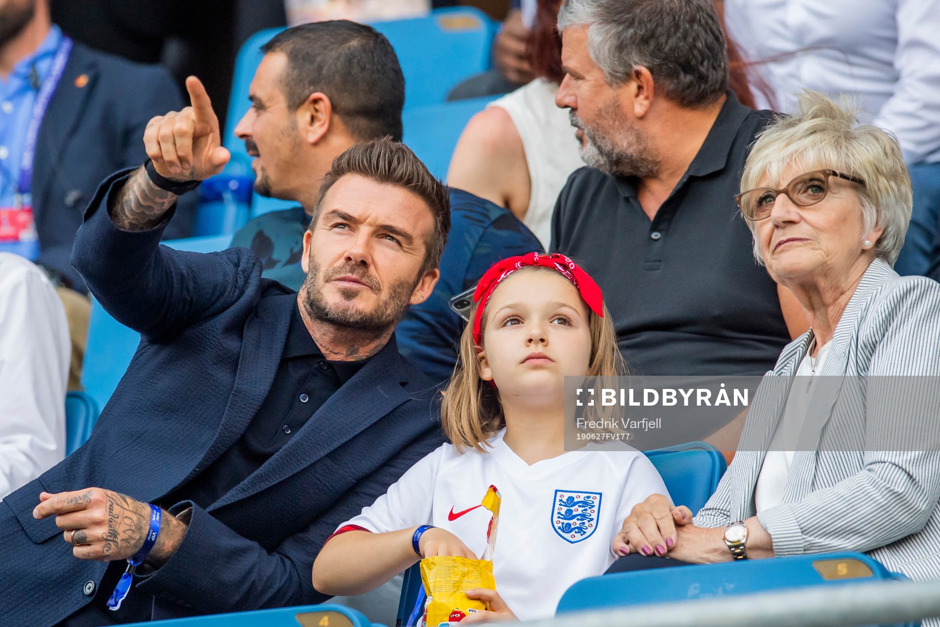 Former football player David Beckham with his daughter Harper and mother Sandra Georgina West in the stands ahead of the FIFA Women's World Cup Quarter Final match between Norway and England on June 27, 2019 in Le Havre.