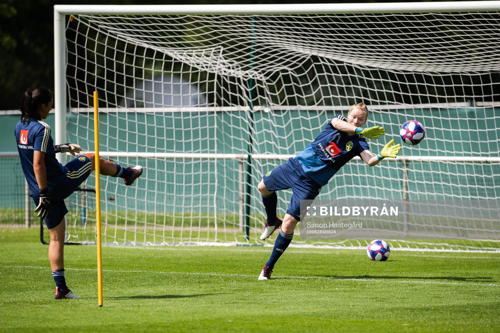 Goalkeepers Zecira Musovic and Hedvig Lindahl of Sweden