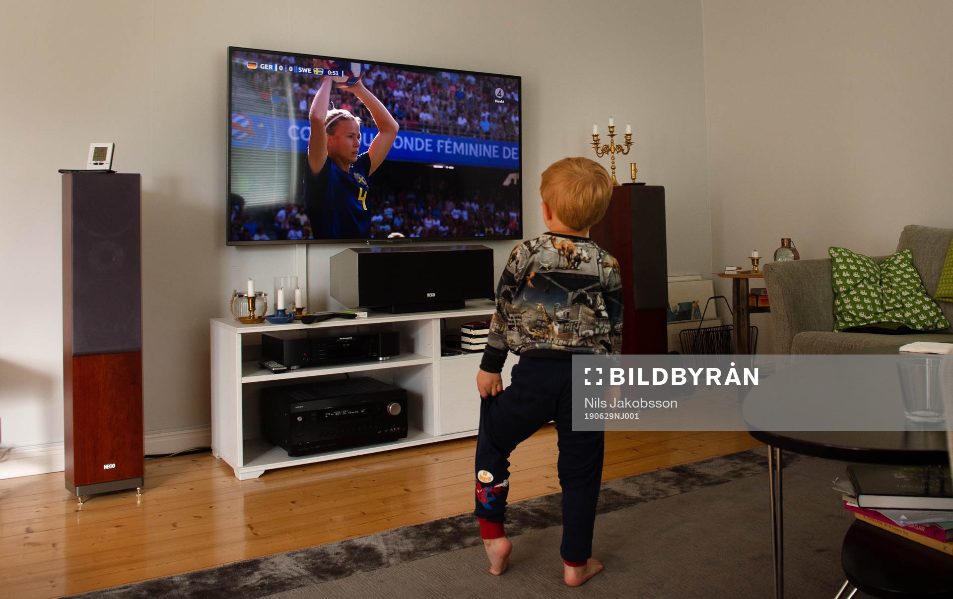 A young boy is watching Magdalena Eriksson